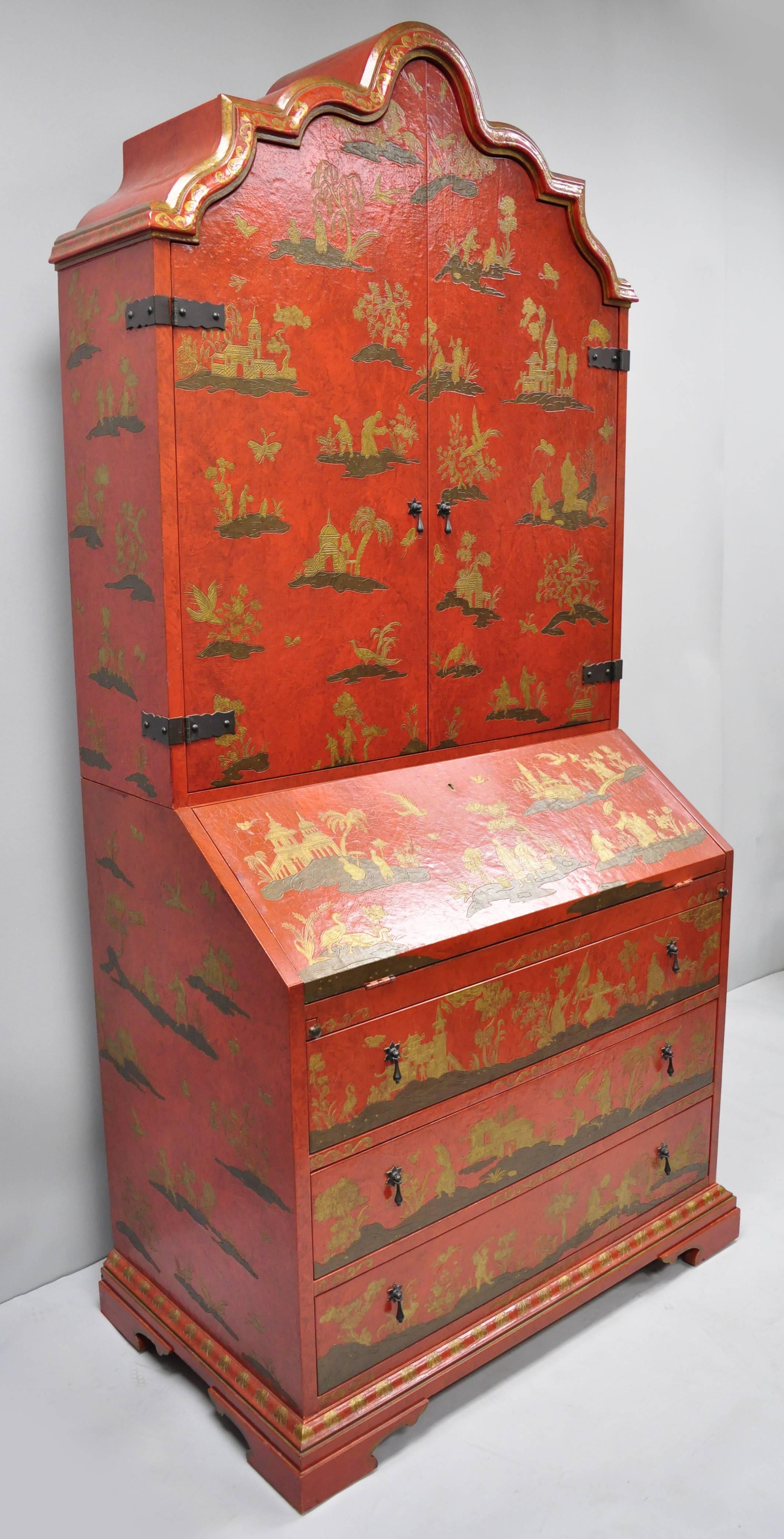 Baker red chinoiserie japanned 1593 Venetian secretary desk - collectors edition. Item features scalloped and bevelled crest above two doors opening to reveal shelves and six drawers, the slant-front desk also opens to six bombe-front drawers, and