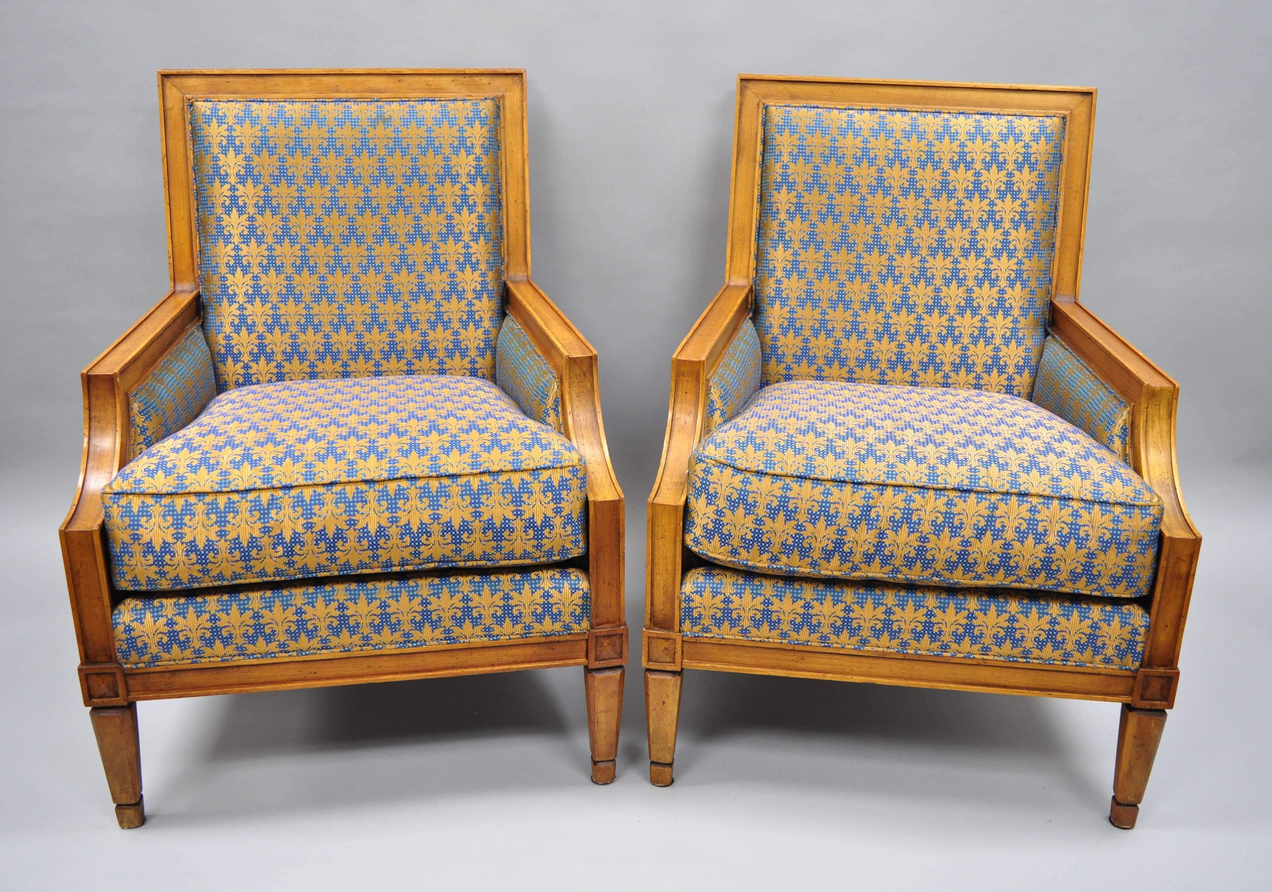 Vintage Baker furniture French Regency / neoclassical style armchairs in the Barbara Barry style. Item features X- form backs, regal blue and gold fabric, solid wood construction, distressed finish, original label, tapered legs, quality American