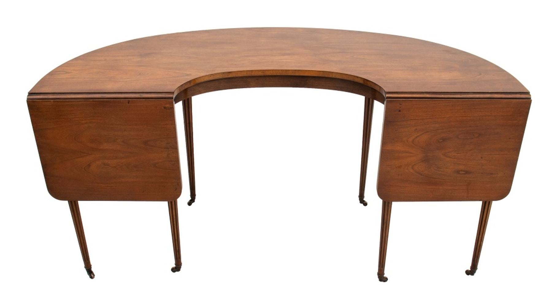 Regency Style Mahogany Drop Leaf Hunt Table, By Baker Furniture, D-shaped on six fluted tapered legs and brass casters, with 