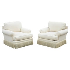 Baker Rolled Arm Fringe Skirt Cream Upholstered Art Deco Club Chairs, a Pair