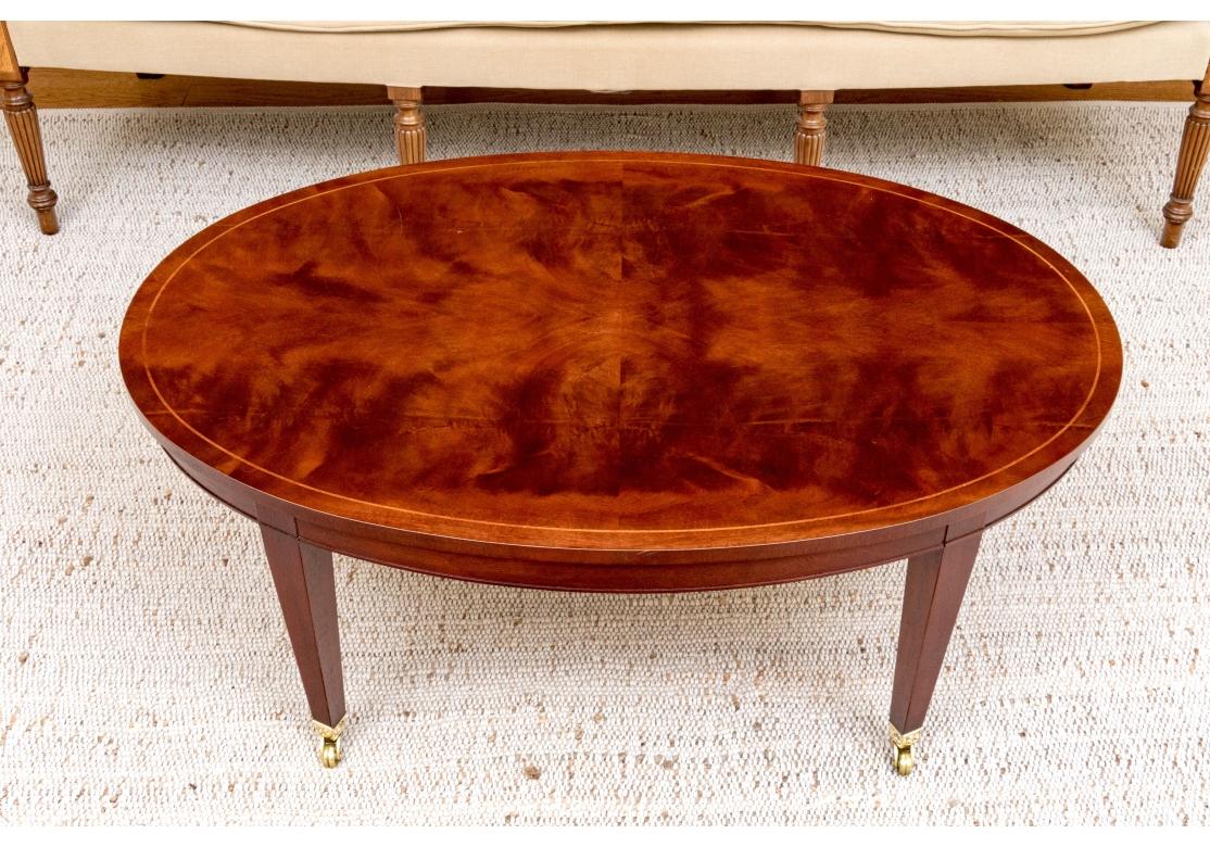 Baker Sheraton Style Mahogany Oval Cocktail Table With Pull Out Trays In Distressed Condition For Sale In Bridgeport, CT