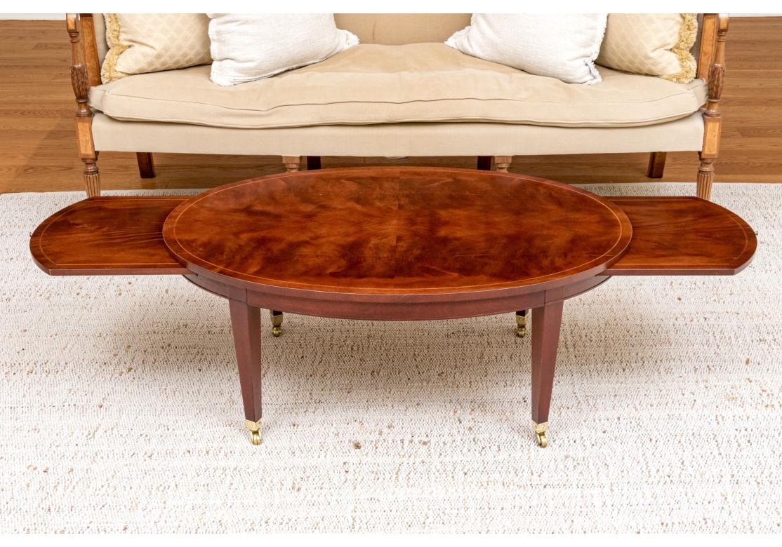 Baker Sheraton Style Mahogany Oval Cocktail Table With Pull Out Trays For Sale 2