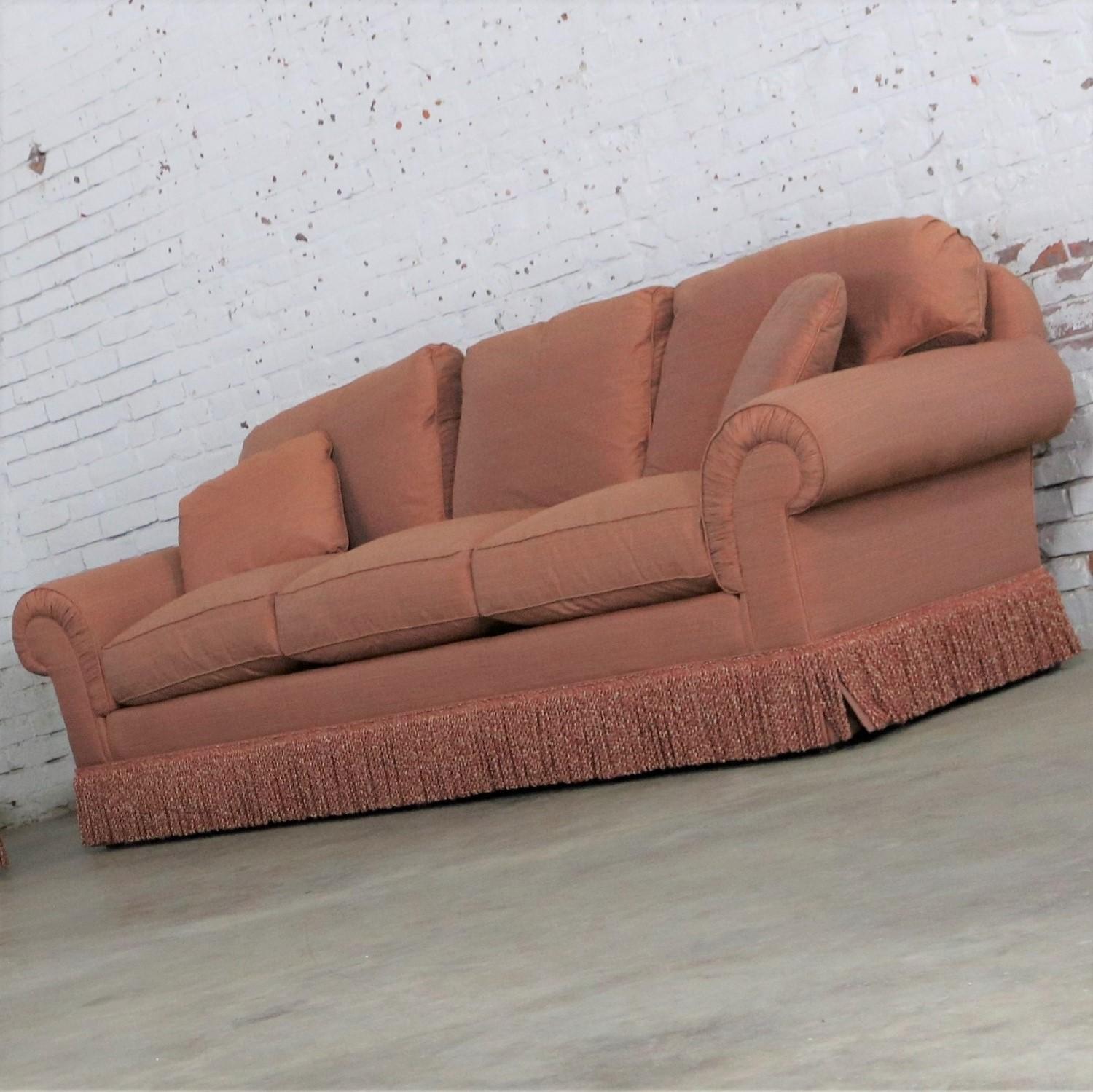 Beautiful Baker Furniture Lawson style sofa from  their Crown and Tulip Collection in a gorgeous terracotta / peach / coral colored ribbed tight weave taffeta-like heavy upholstery fabric with bouillon fringe and poly / feather / down pillows and