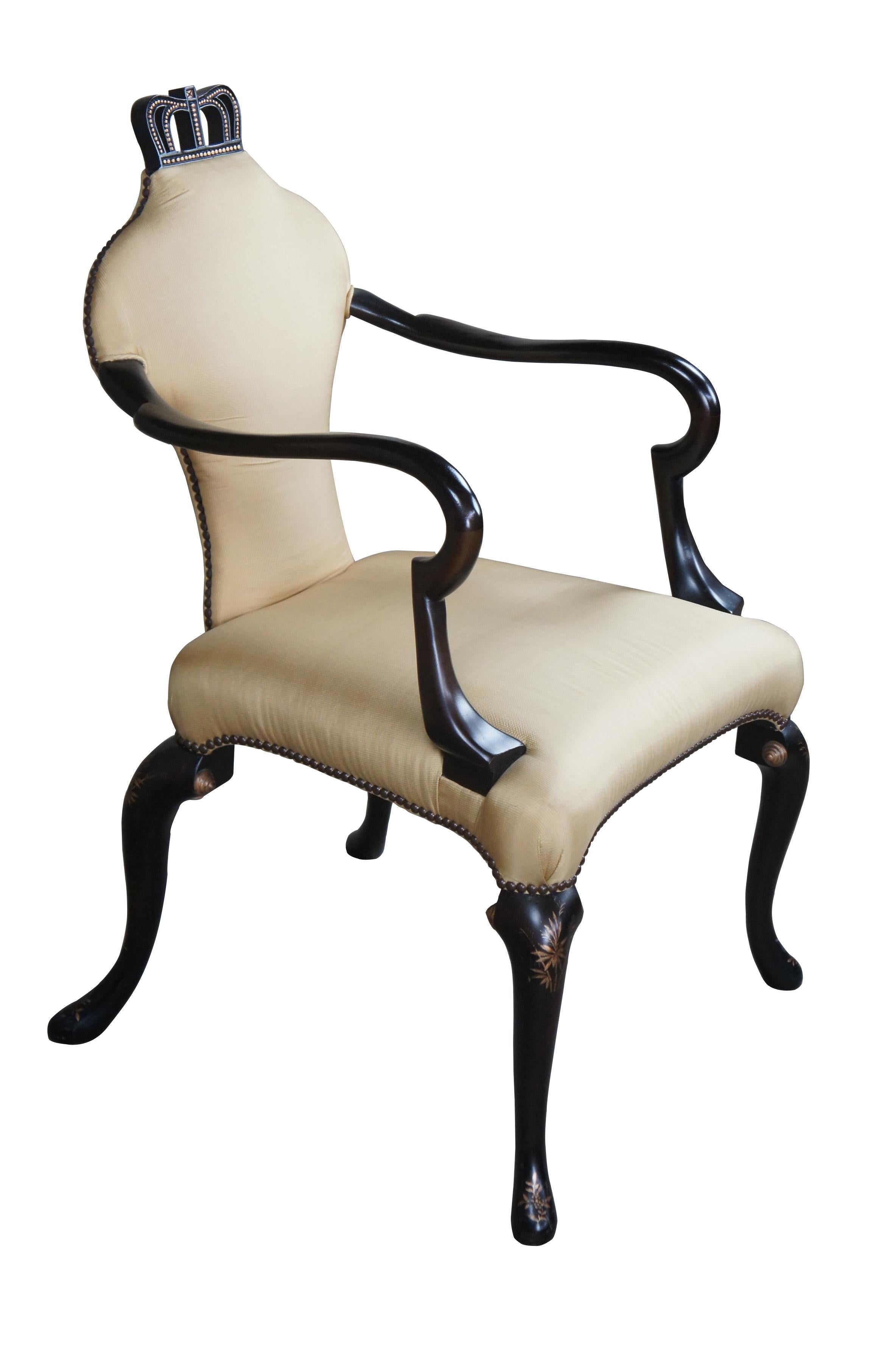 A Queen Anne Chair with an upholstered back in lieu of a splat. Elongated shepherd's crook (gooseneck) arm. Distinctive cabriole legs, with unusual splayed back legs. Nailhead trim. This chair owes to Lord Middleton and the family's home at Wollaton