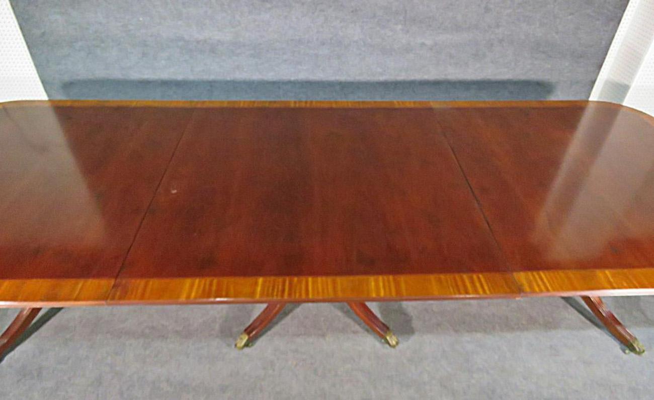 Late 20th Century Baker Williamsburg Satinwood & Mahogany Triple Pedestal Conference Dining Table