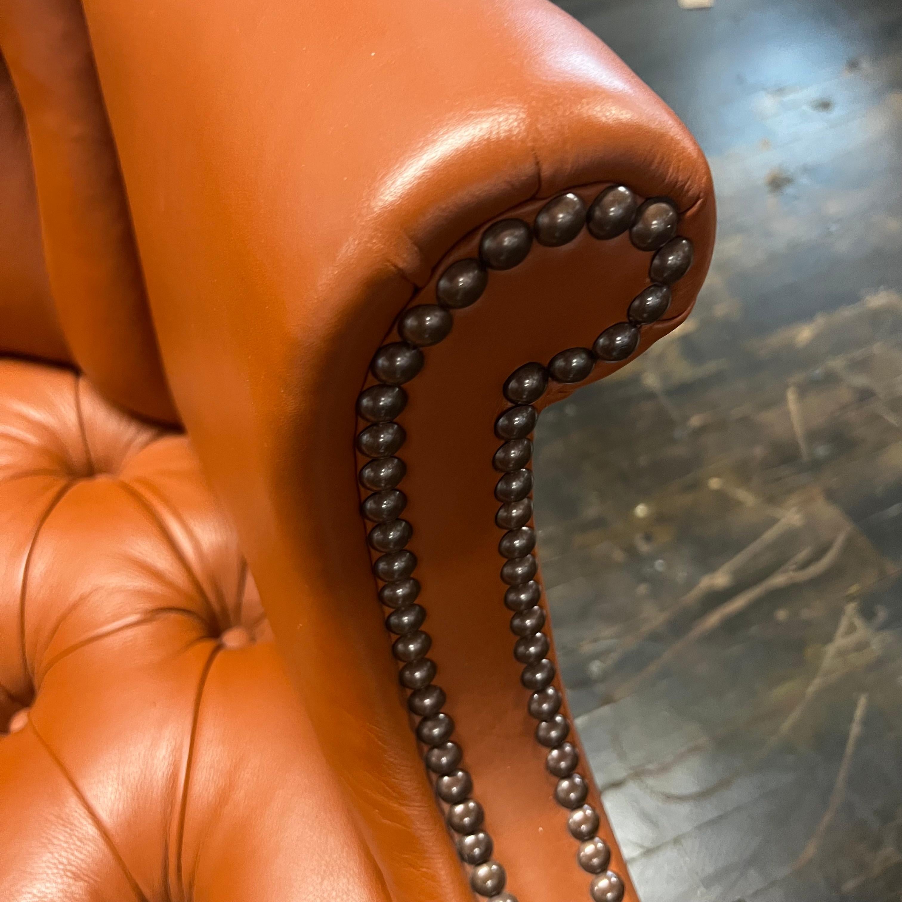 20th Century Baker Wing Back Chair in Holly Hunt Spice Colored Leather with Nailhead Trim For Sale