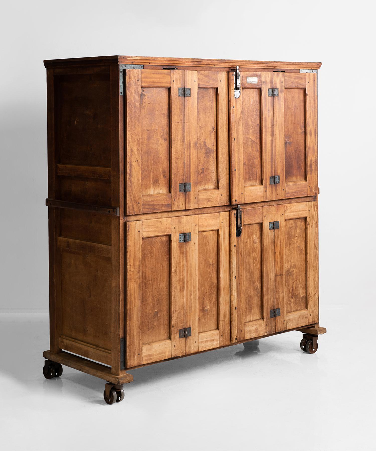Wonderful four door cabinet with pullout cooling racks on original castors.