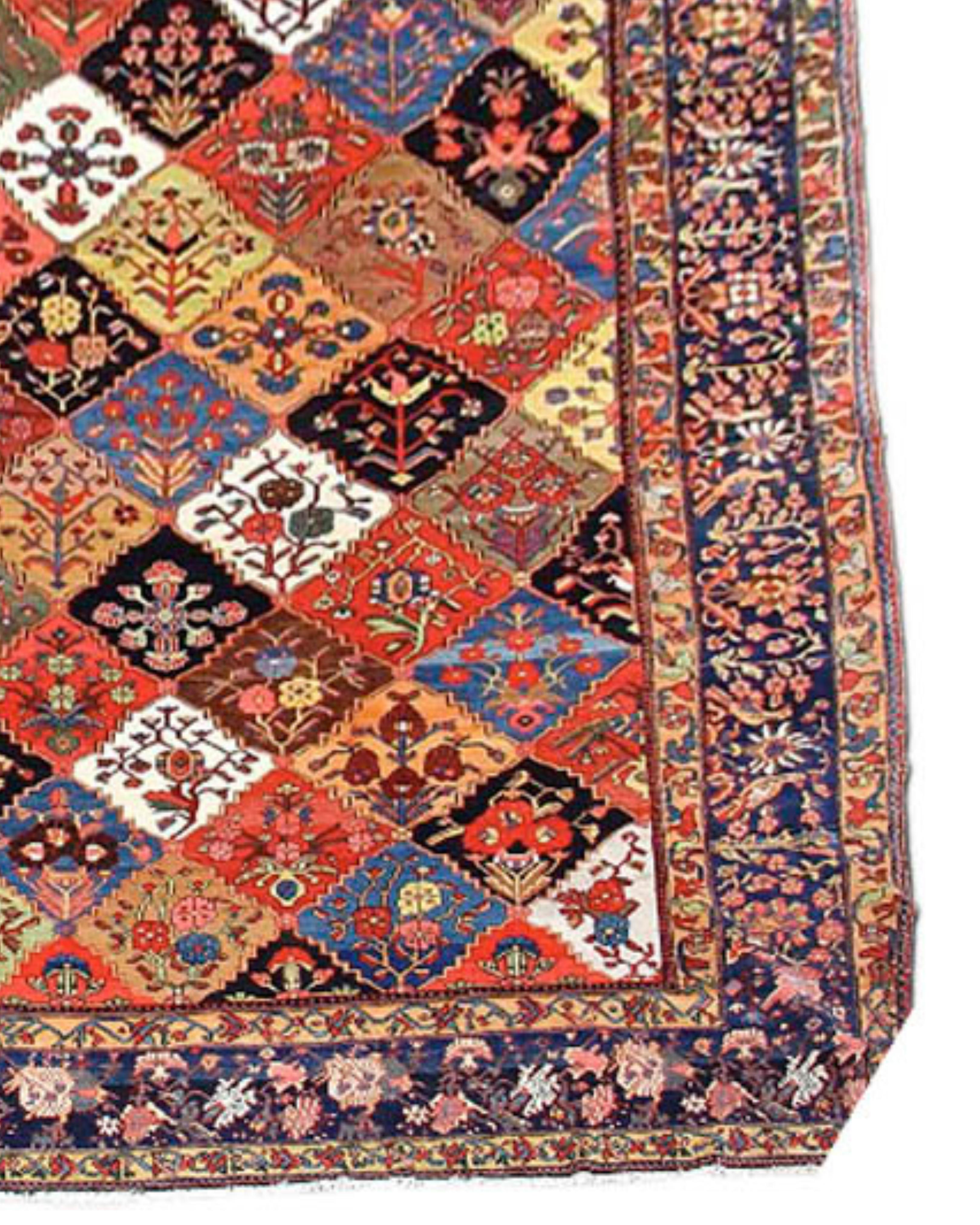 Antique Large Oversized Persian Bakhtiari Carpet, Early 20th Century

Bakhtiari carpets from west-central Persia frequently make use of fields with colorful repeating boxes containing flowering plants. This piece, however, transcends the genre.