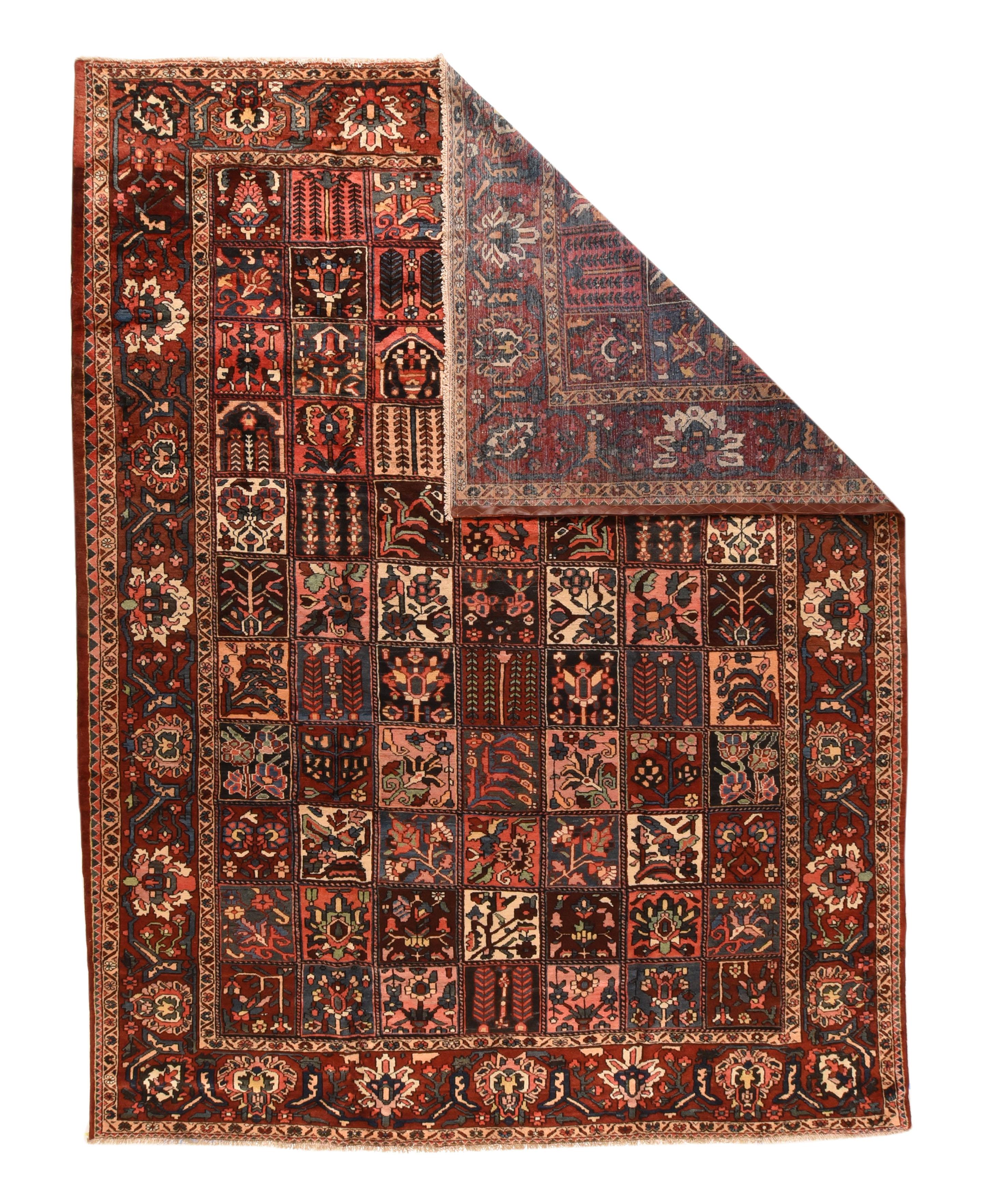 This central Persian Chahar Mahal area village carpet shows a seven by elven “garden” windowpane panel design with mihrabs, weeping willows, flowering vases, twinned feathery fronds and blossoming stems, with grounds of cream, navy, rust-red, green