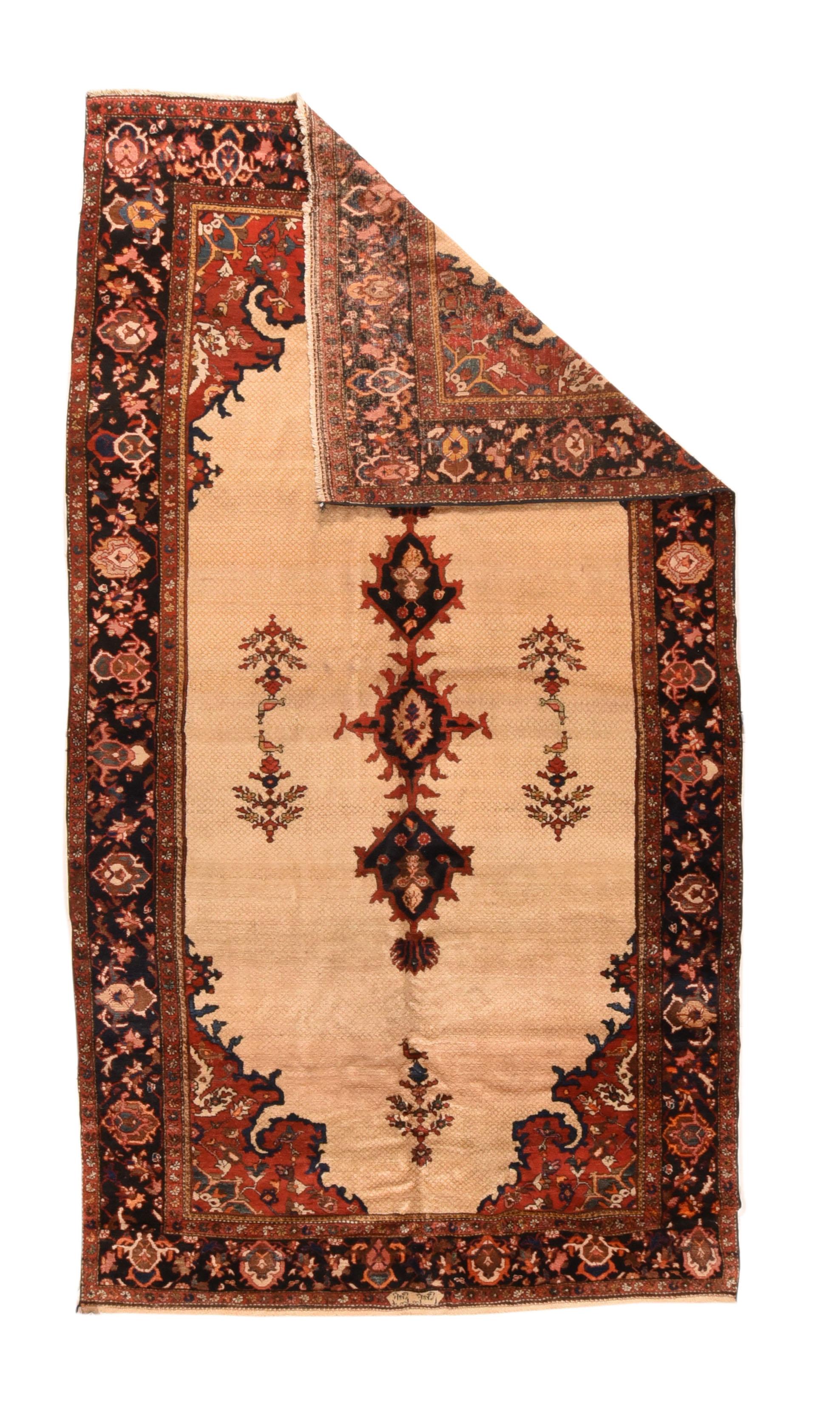 This very attractive west Persian village kellegi (long rug) is well-woven on cotton, and shows an abrashed straw-eggshell and golden beige micro-lattice field supporting a small ragged hexagonal medallion and stepped, ragged pendants, with six