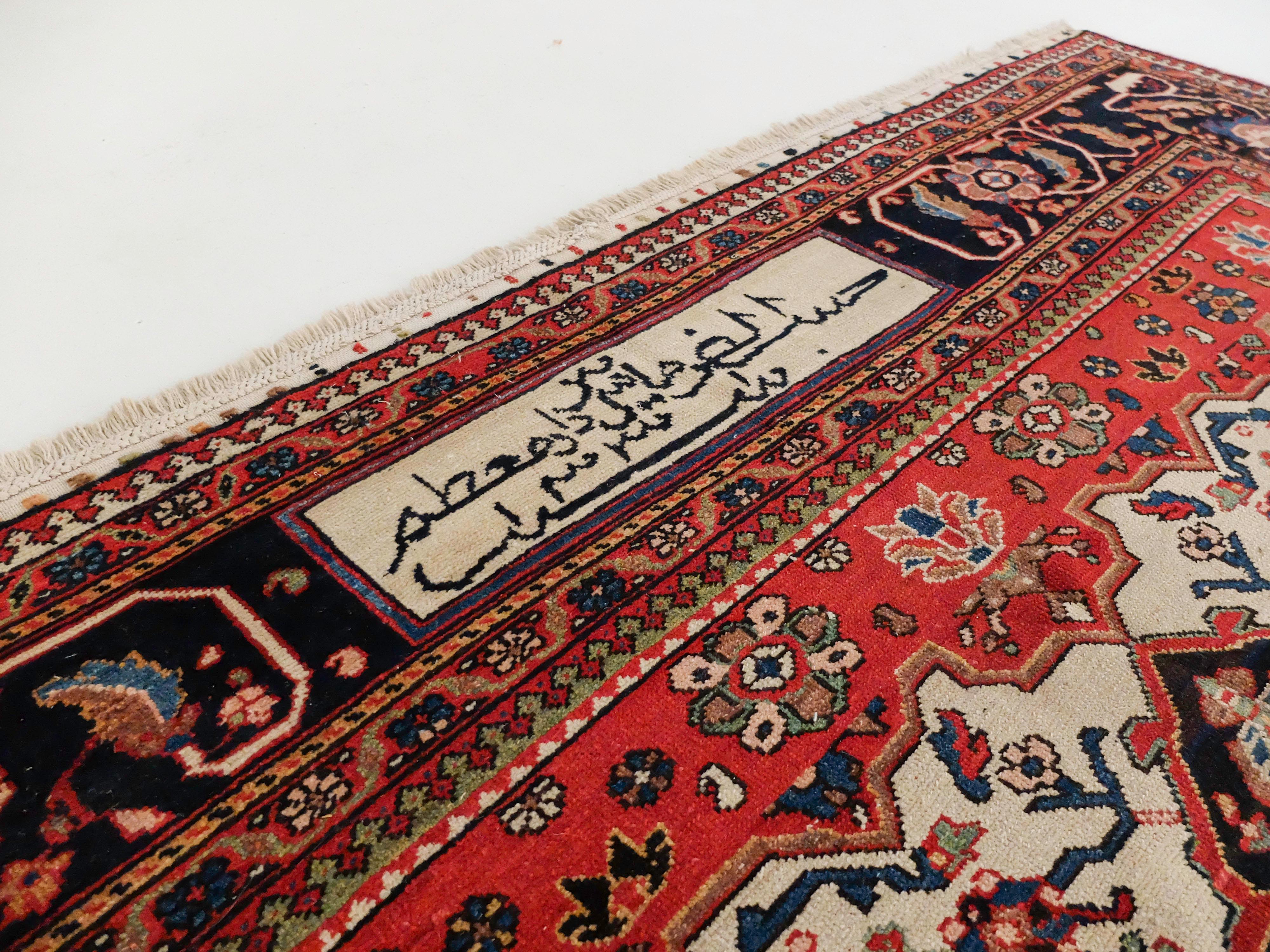 This absolutely stunning antique Bakhtiari Rug is in great condition for its age. Its colors are still highly saturated and extremely eye-catching. The way the black grounds the red which is even further highlighted by the cream is an example of a