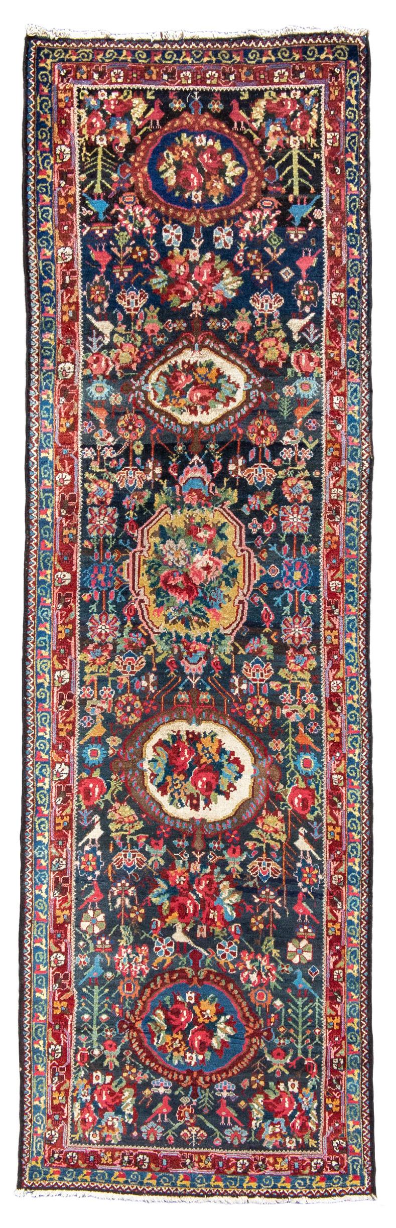 Antique Persian Bakhtiari Runner Rug, 20th Century

Incorporation of European design motifs like cabbage roses but also the occasional nomadic folk art figures.

Additional information:
Dimensions: 3'6