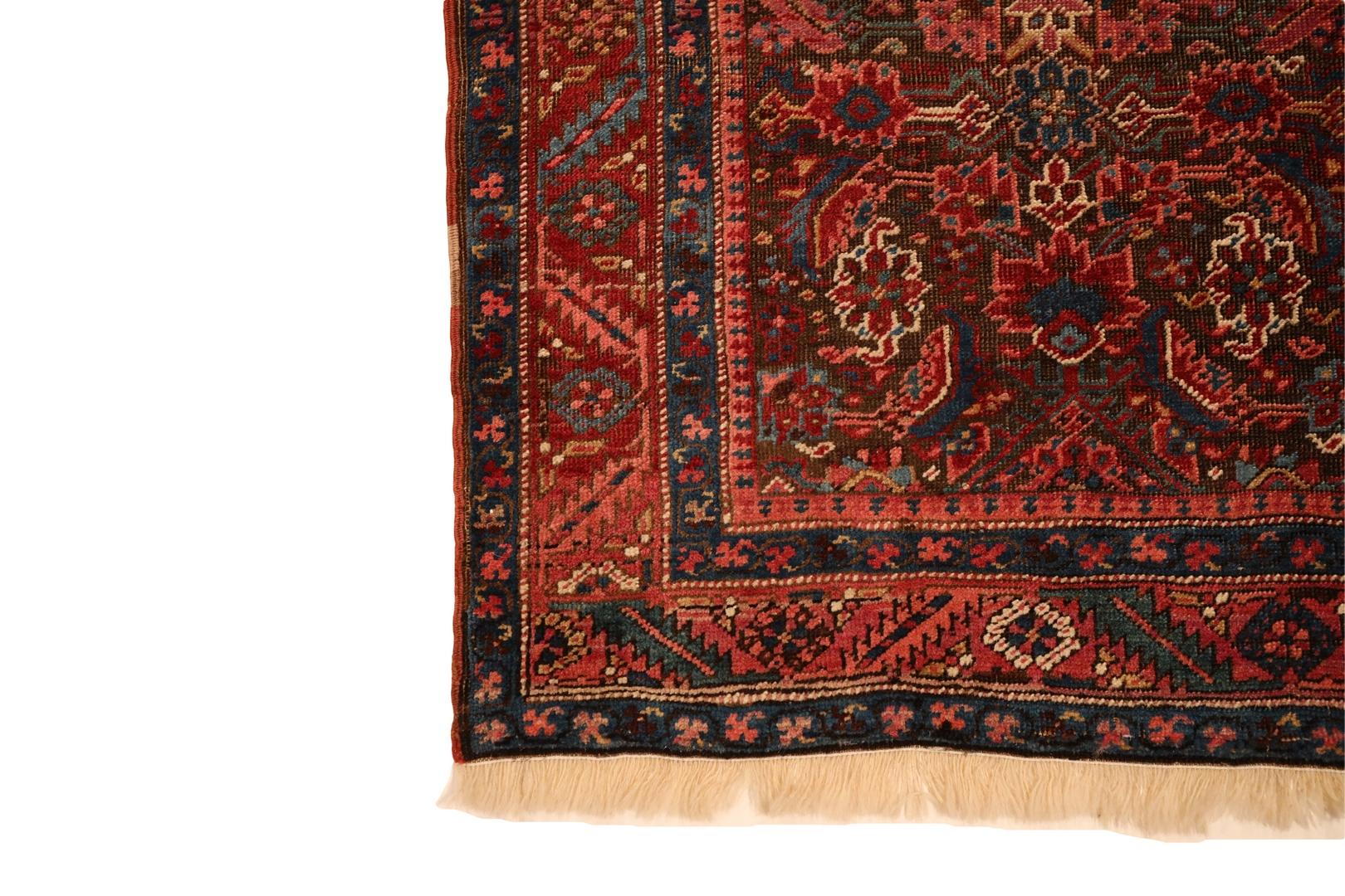  Presenting the Bakhshaish Runner, a captivating masterpiece that seamlessly weaves together tradition and timeless elegance. This vintage rug features a rich rust-brown background, adorned with an all-over geometric floral design that unfolds in a