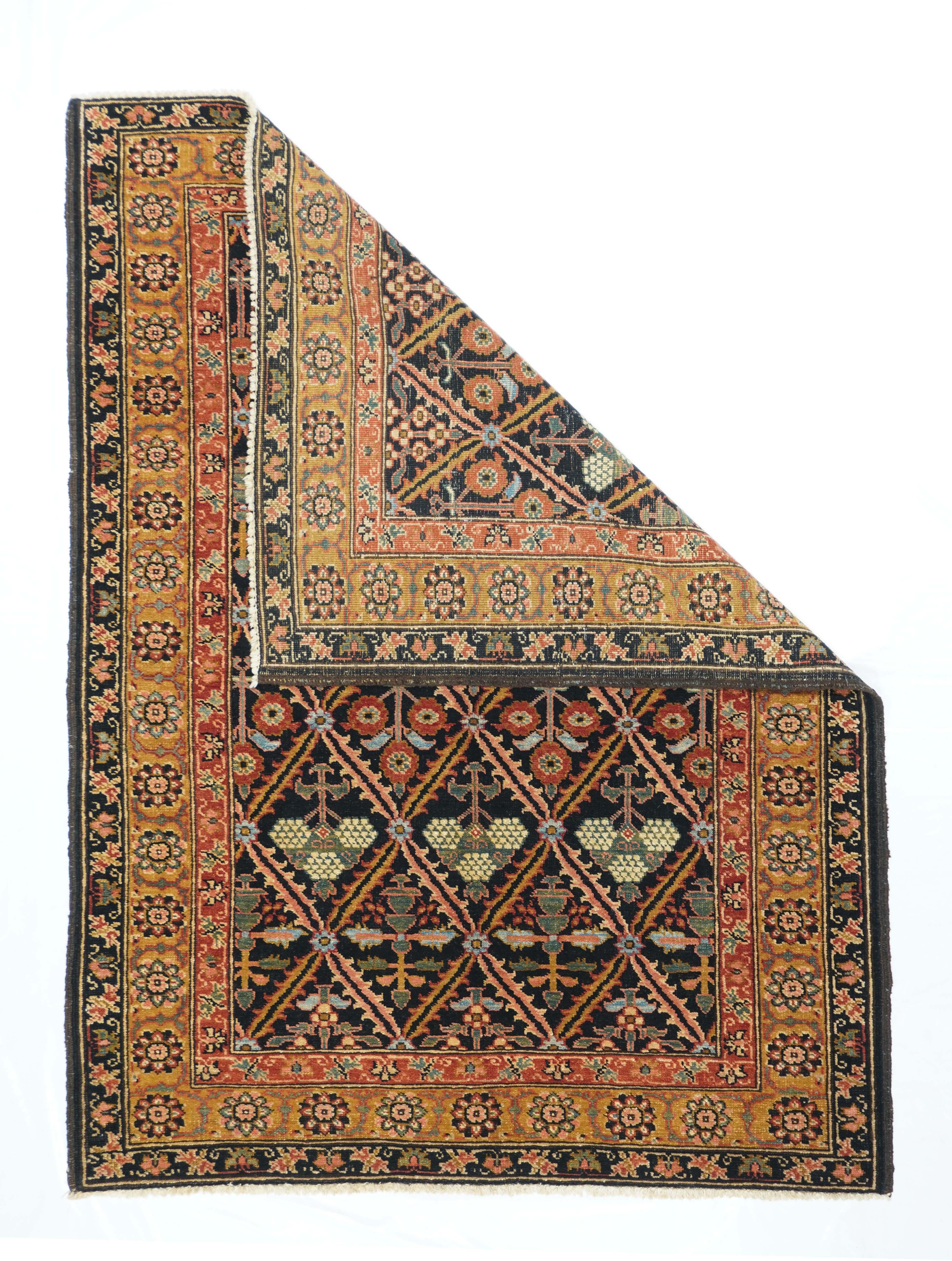 Bakhshaish rug¬†4'1'' x 5'10''. This antique rustic NW Persian scatter presents a deep blue serrated leaf lozenge lattice enclosing four distinct row styles of flowers including poppies and prunus. Straw-gold rosette border. Excellent field balance.