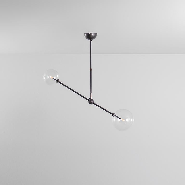 Balance 150 x 150 Brass Chandelier by Schwung
Dimensions: W 90 x D 15 x H 160 cm
Materials: Natural brass, hand blown glass globes, finish in black gun metal

Other finishes available
Available in W 97 x D 20 x H 70 cm.

Extensions Rods: 43