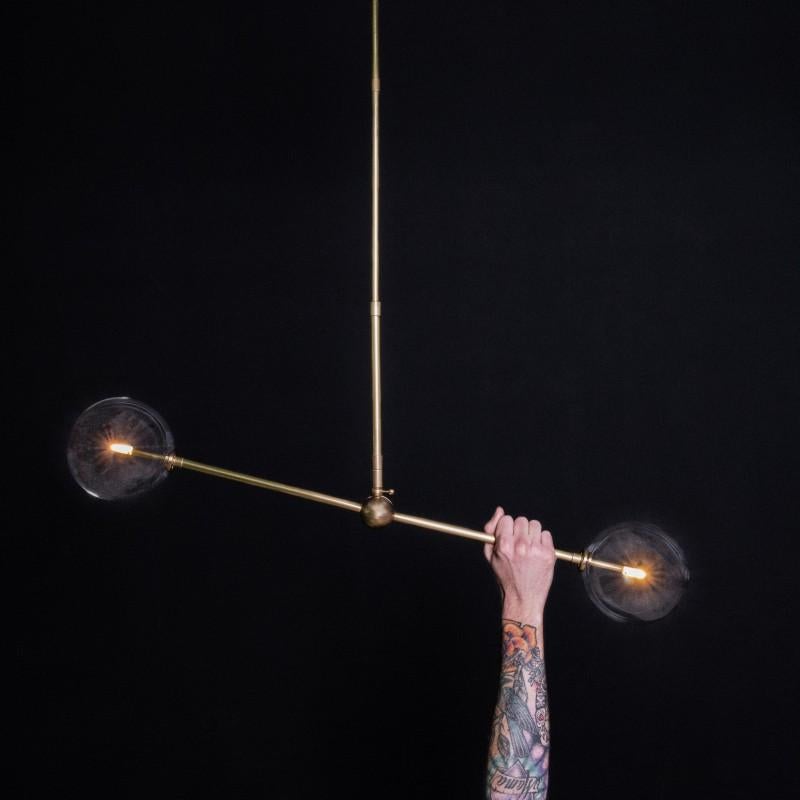 Brass 200 x 150 contemporary chandelier by Schwung
Dimensions: D 15 x W 90.5 x H 160 cm 
Materials: Solid brass, hand-blown glass globes
Finish: Natural brass. 
Available in finishes: Black Gunmetal or polished nickel. Also available in