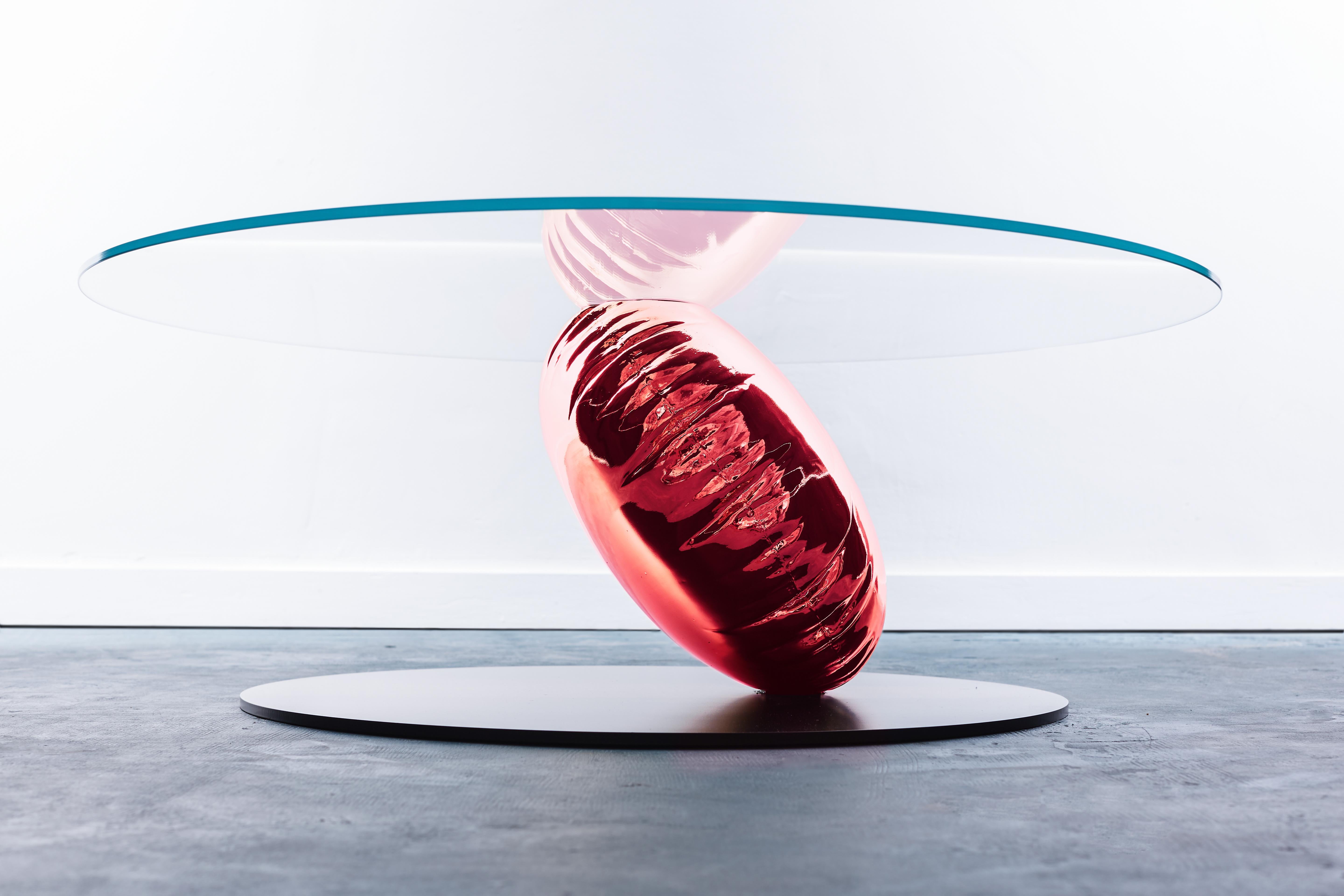 Balance is as much sculpture or art as furniture as it is a functional furniture piece.  An eye-catching, concept coffee table design from acclaimed British designer Christopher Duffy.

A single gold helium balloon stands on a thin black disc giving