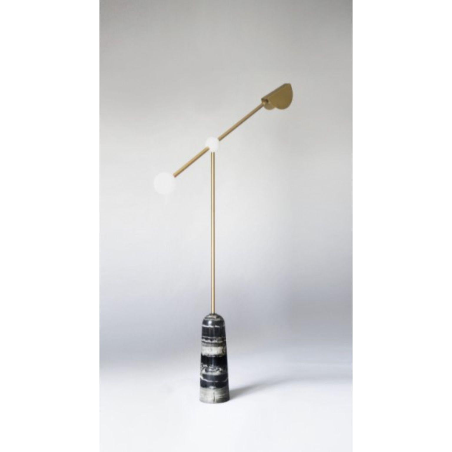 Balance floor lamp by Square in Circle
Dimensions: D 40 x H 147 cm
Materials:Brushed brass / white frosted glass / white powder coated metal / honed black
Other finishes available.

An elegant and minimal floor lamp with a rounded tapered black