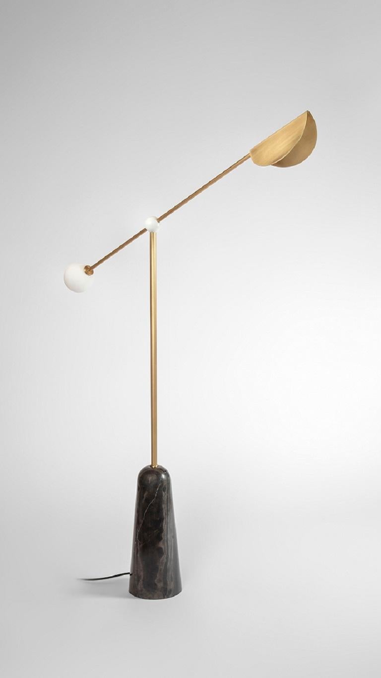 Balance Floor Lamp by Square in Circle
Dimensions: D 40 x H 147 cm
Materials:Brushed brass / white frosted glass / white powder coated metal / honed black
Other finishes available.

An elegant and minimal floor lamp with a rounded tapered black
