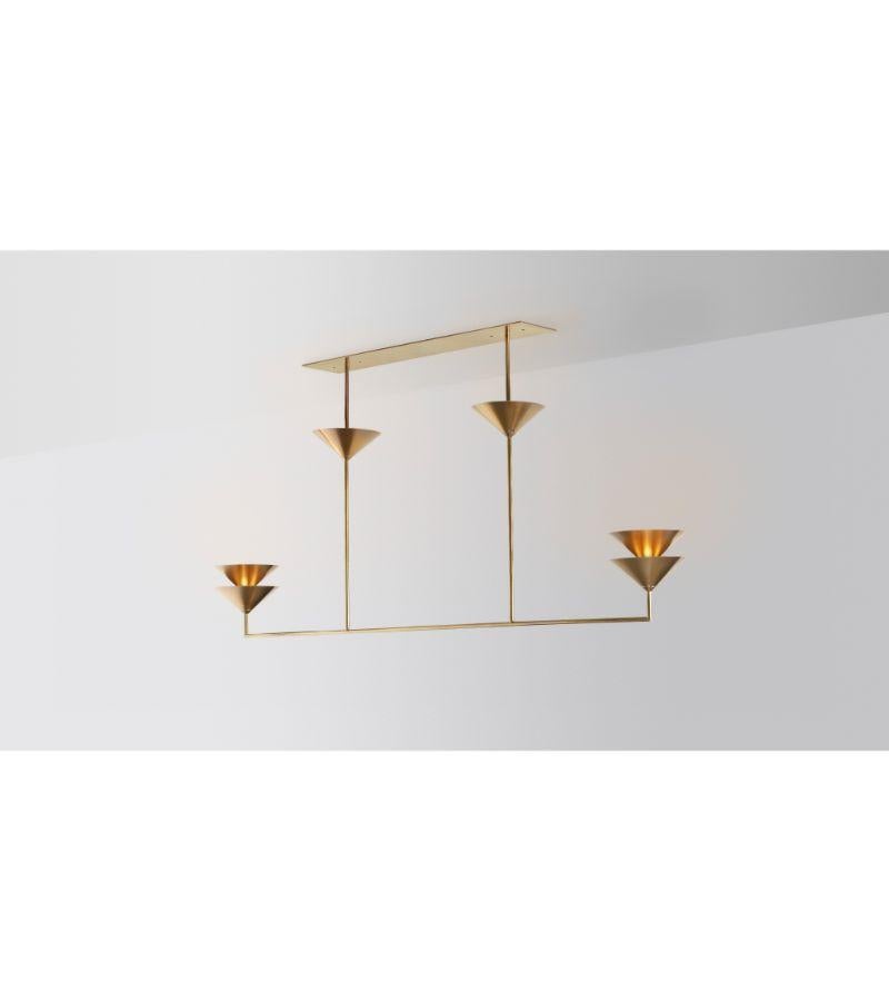 Balanced stack pendant light by Volker Haug
Dimensions: D 21 x W 182 x H 70 cm 
Material: Brass. 
Finish: Polished, aged, brushed, bronzed, blackened, or plated
Light: 12V G4 LED x 18
Hardwiring: Two points
Power supply: 110V-240V, 12V
