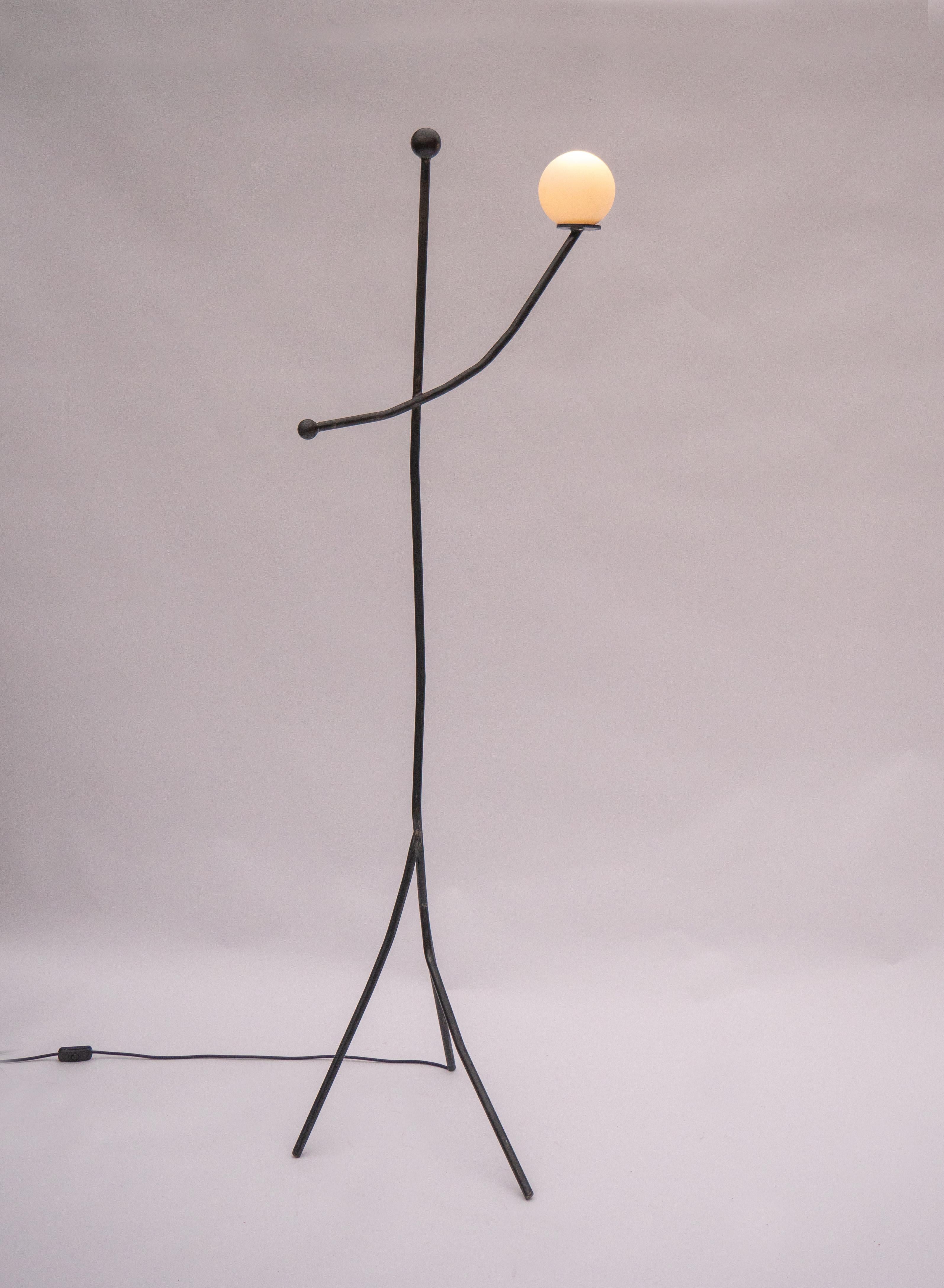 A welded Steel Floor Lamp. Balancing Act is a collection of two lamps and a candle holder. Inspired by Calder’s Circus, it captures a sense of naive joy and playful freedom, inviting interaction and spontaneity through balanced forms and whimsical