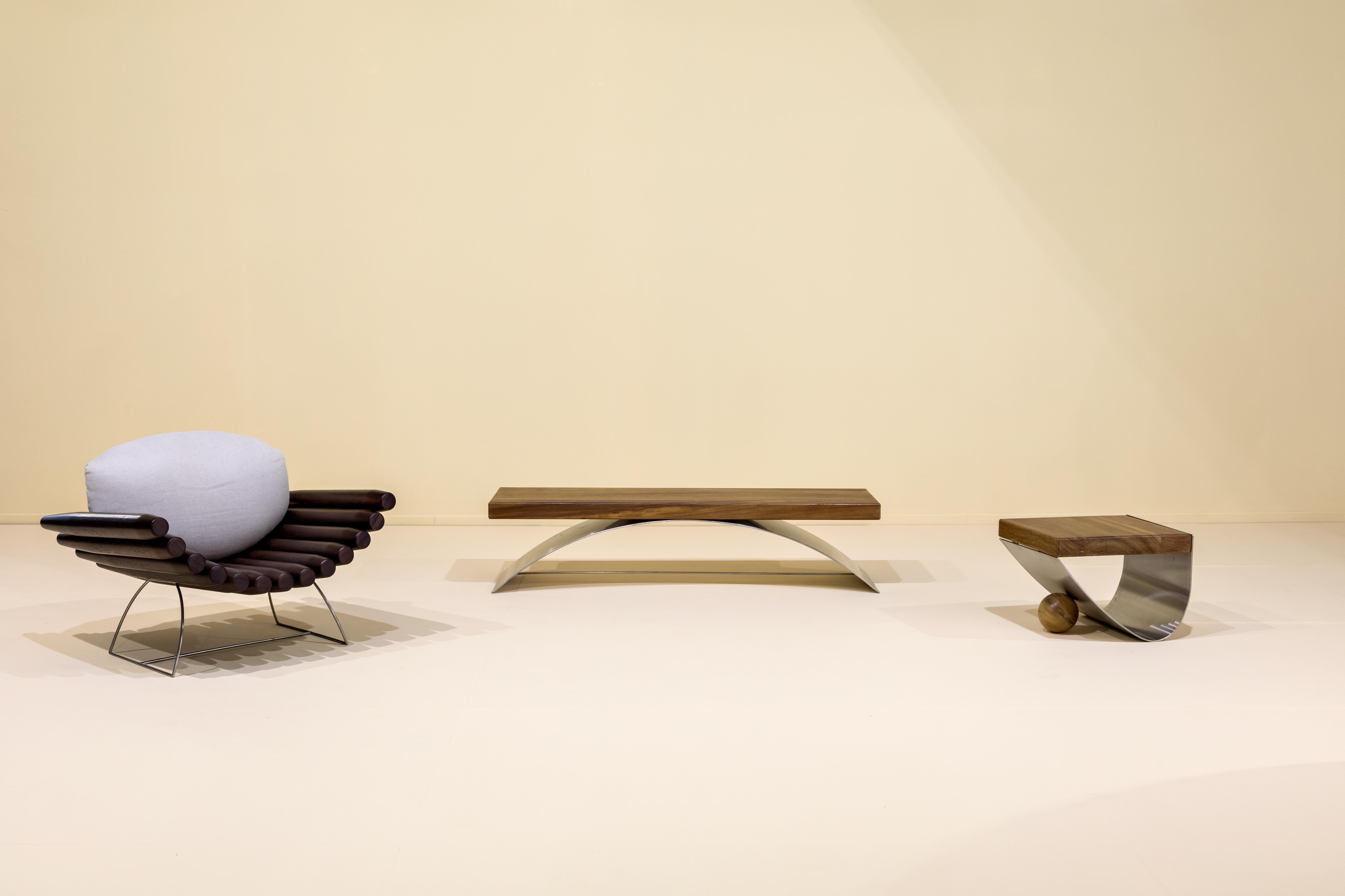 The Balanço Bench was created by the Brazilian contemporary designer Rodrigo Ohtake, in 2019.

The mix of materials is the differential in this series. While wood is used as a seat, a metal plate, thick and curved, raises the first material from the