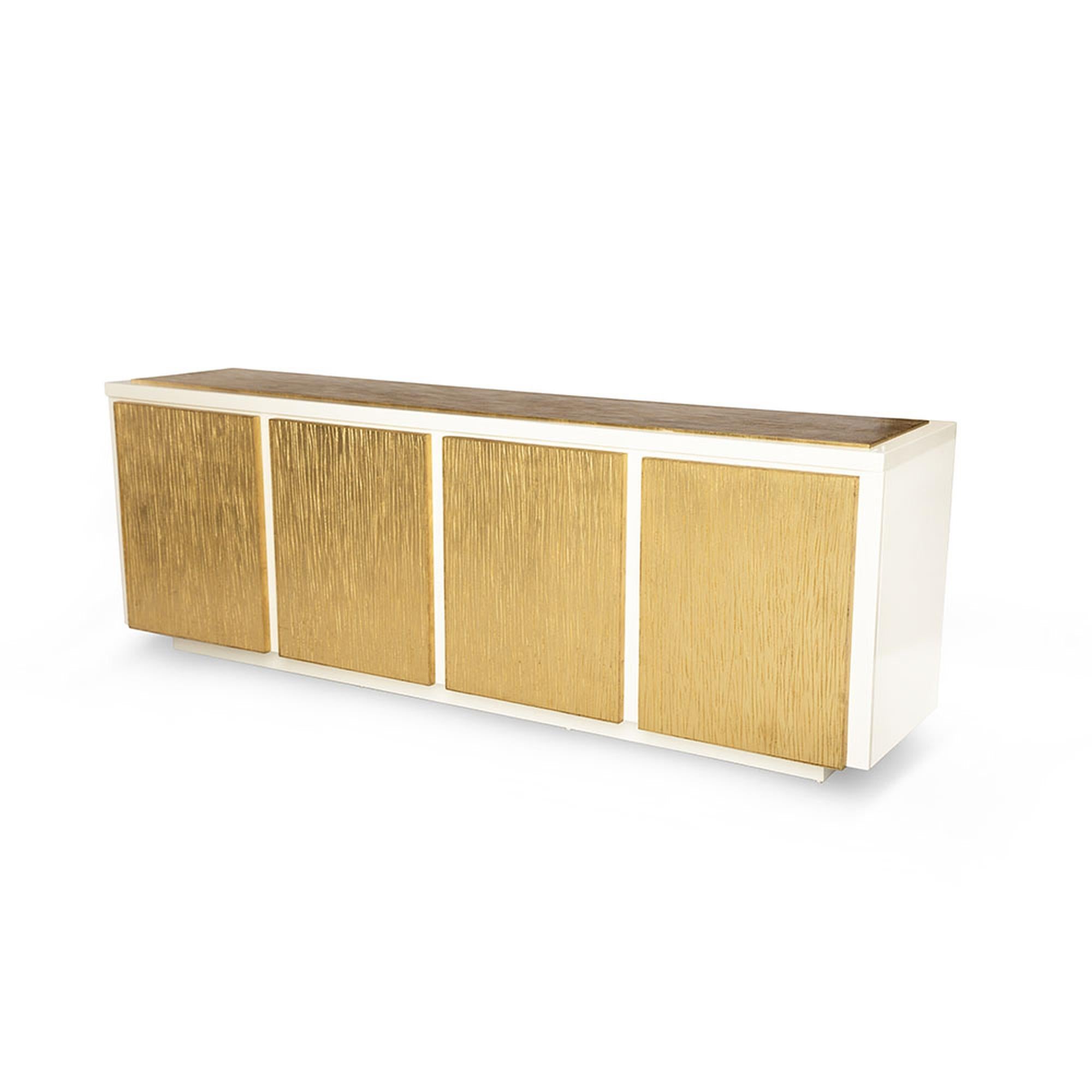 The Balboa credenza is an incredibly sophisticated piece, from the carefully chiseled, hand gilded doors and top, to the beautifully hand-lacquered smooth body. Finished to perfection, it serves as a gorgeous statement piece. The push-to-open doors