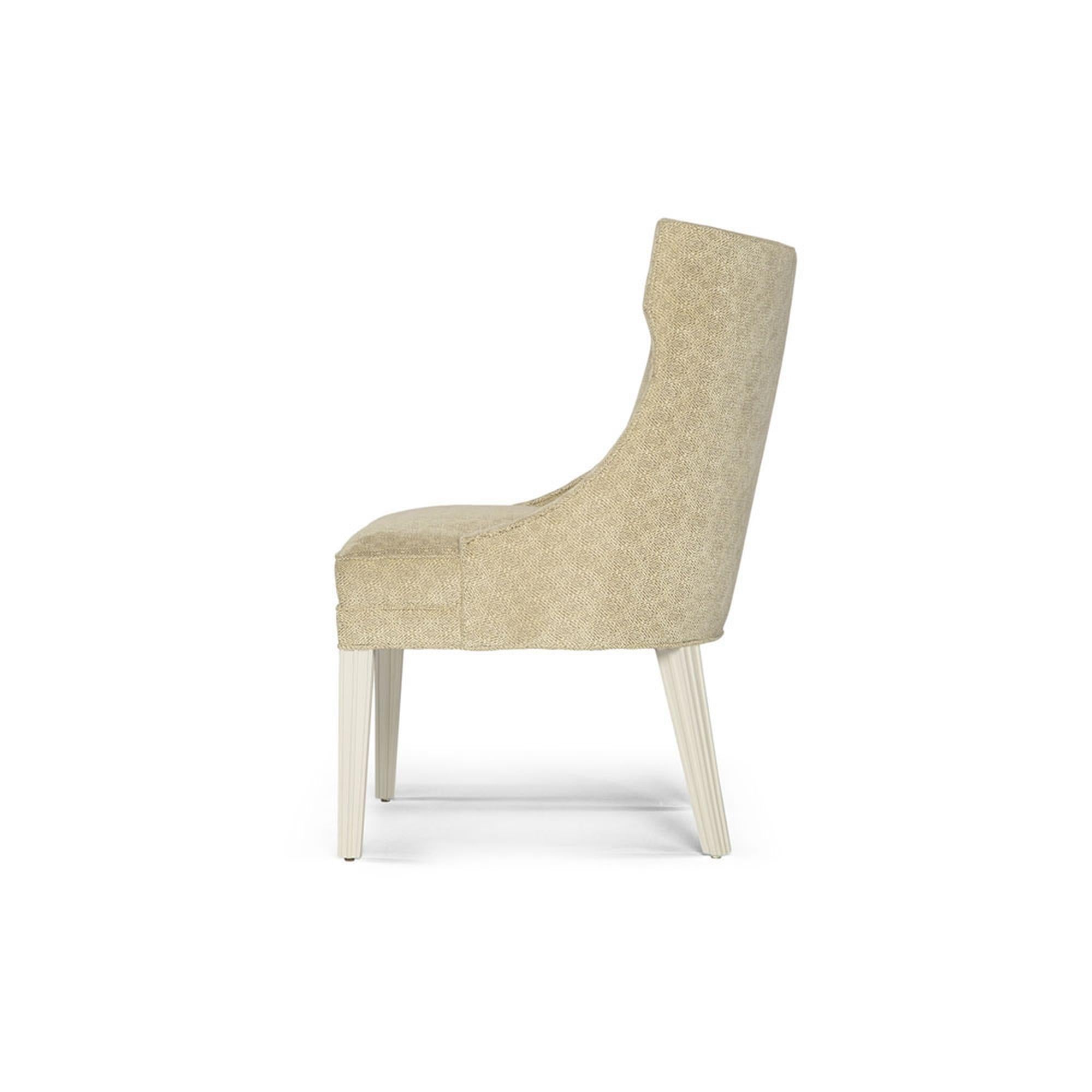 Make a bold statement with this unique Balboa dining chair. Designed with ample space, this chair consists of sloped arms and a rounded back that is elegantly angled to embrace your guest with utmost comfort. Designed to compliment the Balboa dining