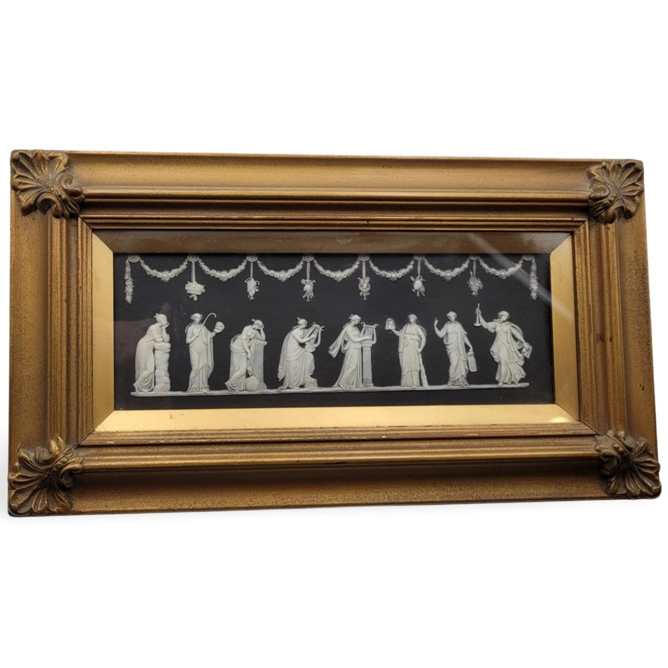 Plaque in solid black jasperware, decorated with eight of the nine muses:

Polyhymnia - The muse of sacred poetry, hymn, and eloquence as well as agriculture and pantomime. She represents deep contemplation and sacred hymns.
Thalia - The muse of