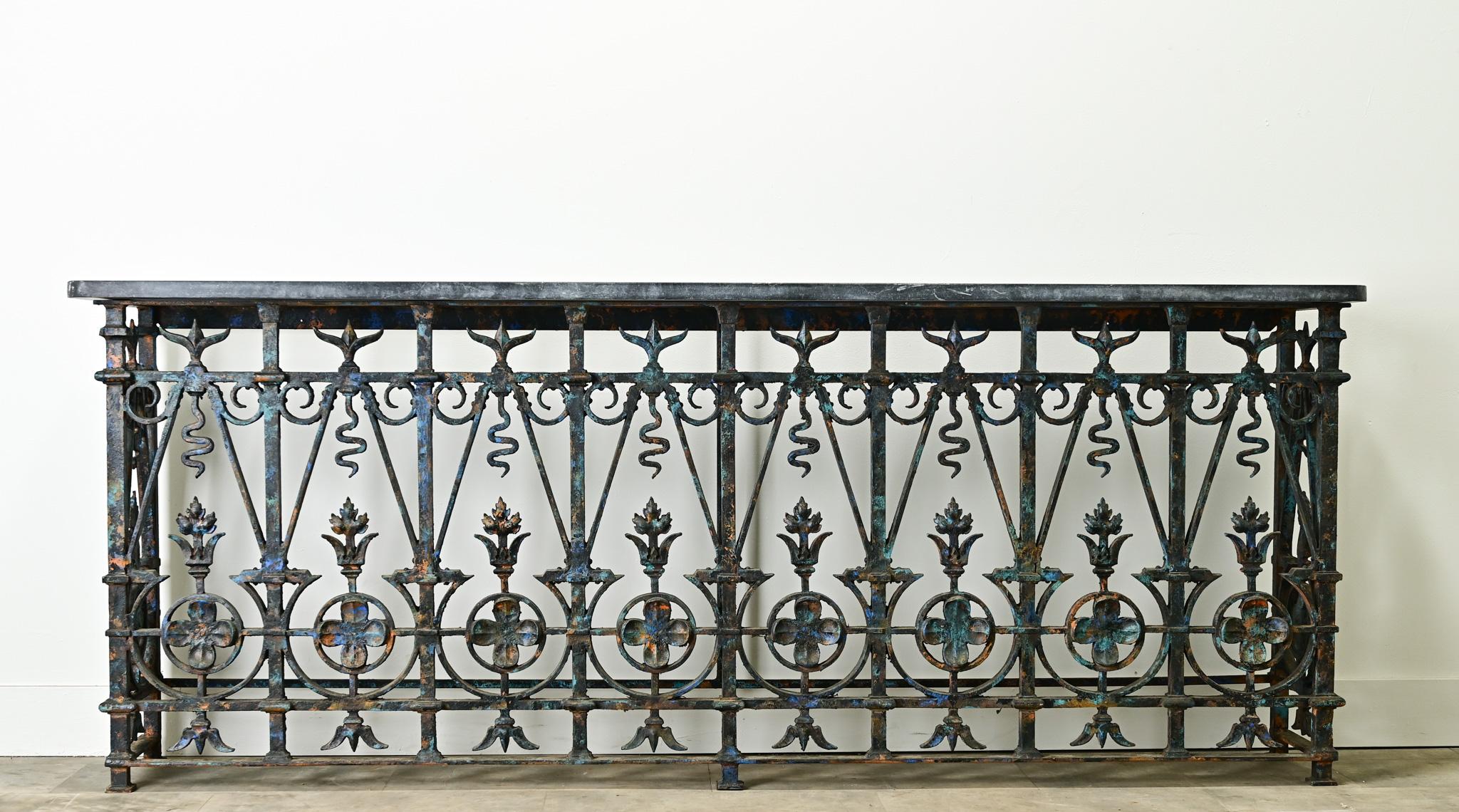 French balconies have always been admired for their iron craftsmanship and are often repurposed as furniture.  This impressive wrought iron balcony has playful patterns and designs with a worn painted finish and makes the perfect base. A new Belgium