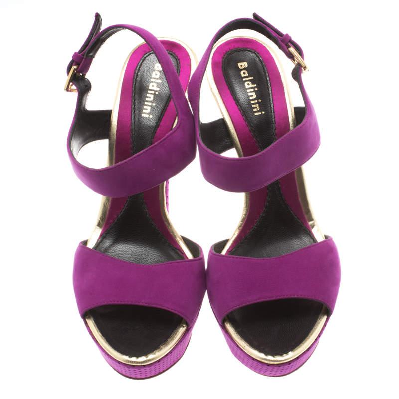 A dazzling diva needs a mesmerizing pair to complement her personality and these Baldinini sandals are just the perfect choice. They've been made from purple suede and designed with ankle straps and 14 cm heels supported by platforms. Make this pair
