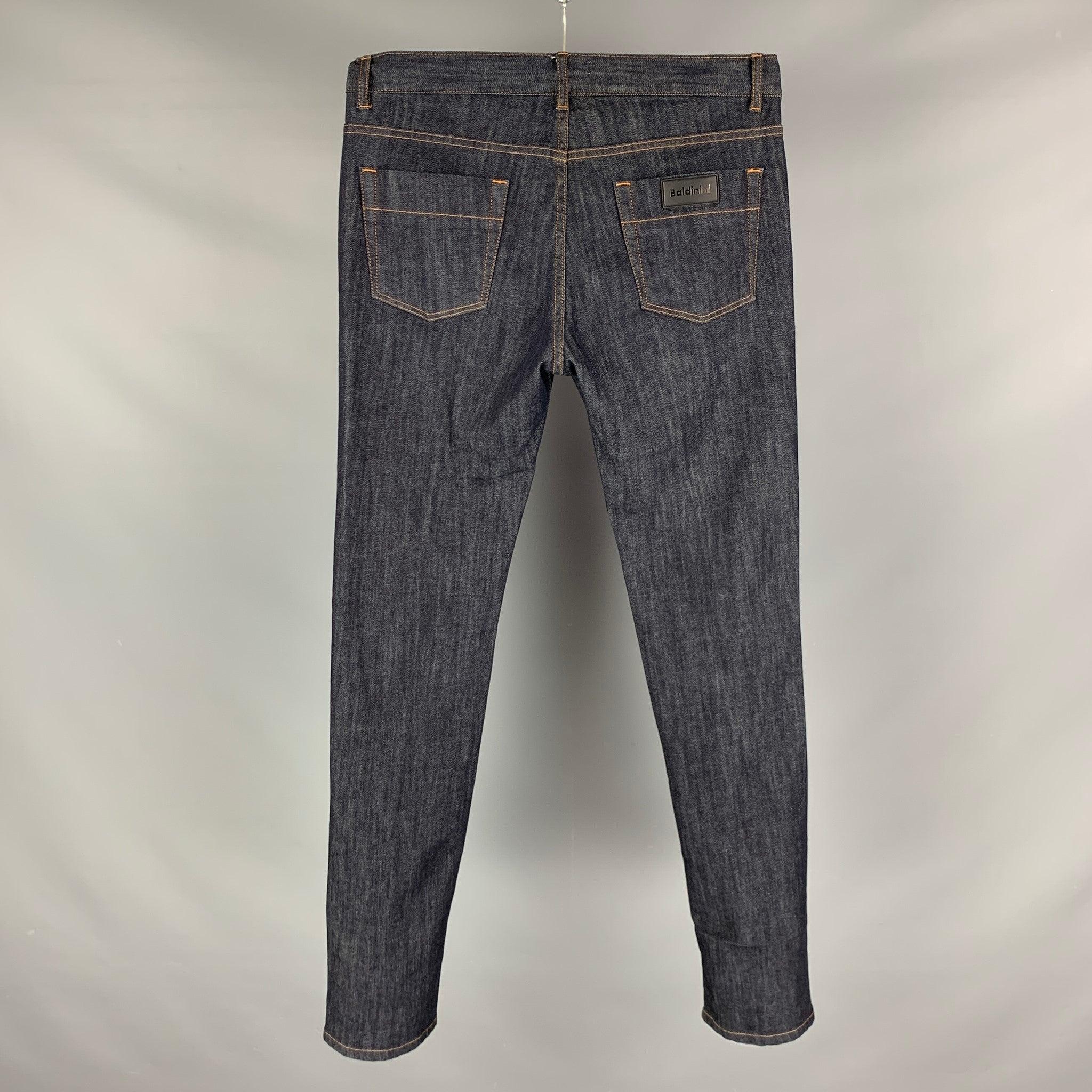 BALDININI jeans comes in a navy cotton and elastane denim featuring a straight fit, contrast stitching, and a zip fly closure. Made in Italy.Excellent Pre- Owned Conditions. 

Marked:   34 

Measurements: 
  Waist: 34 inches Rise: 13 inches Inseam: