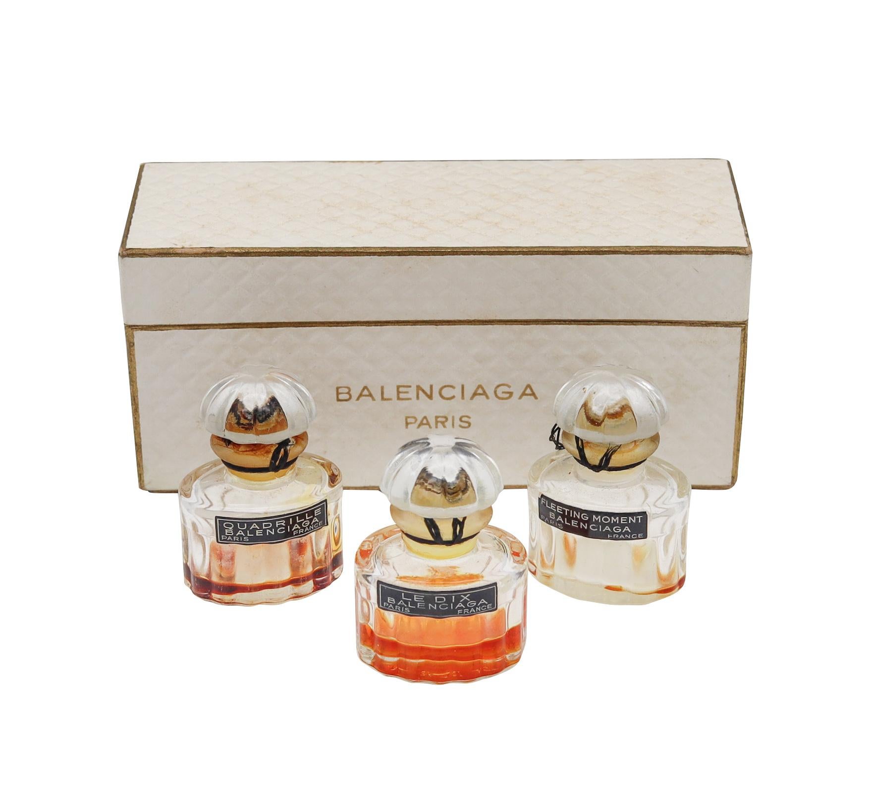 Balenciaga Paris perfume bottles trio in box.

Offered here is a darling trio of great Balenciaga perfumes in little quarter ounce flacons. The perfumes have been opened, and each is still have some remains. It would seem that all labels are still