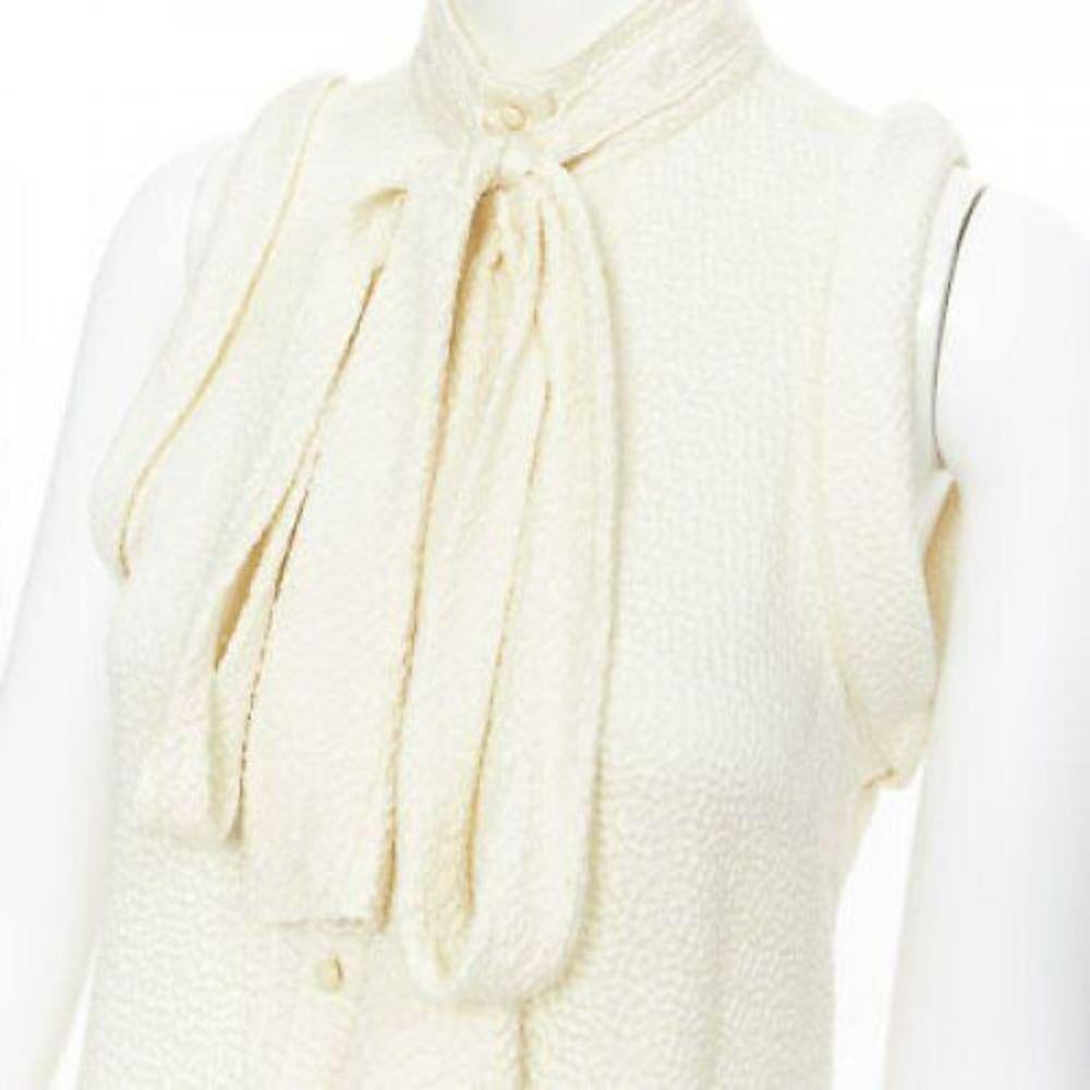 BALENCIAGA 2006 100% silk textured pussy bow drop armhole blouse vest top FR38
Reference: CC/AECG00310
Brand: Balenciaga
Model: Silk vest
Material: Silk
Color: Beige
Pattern: Solid
Closure: Button
Made in: Italy

CONDITION:
Condition: Very good,