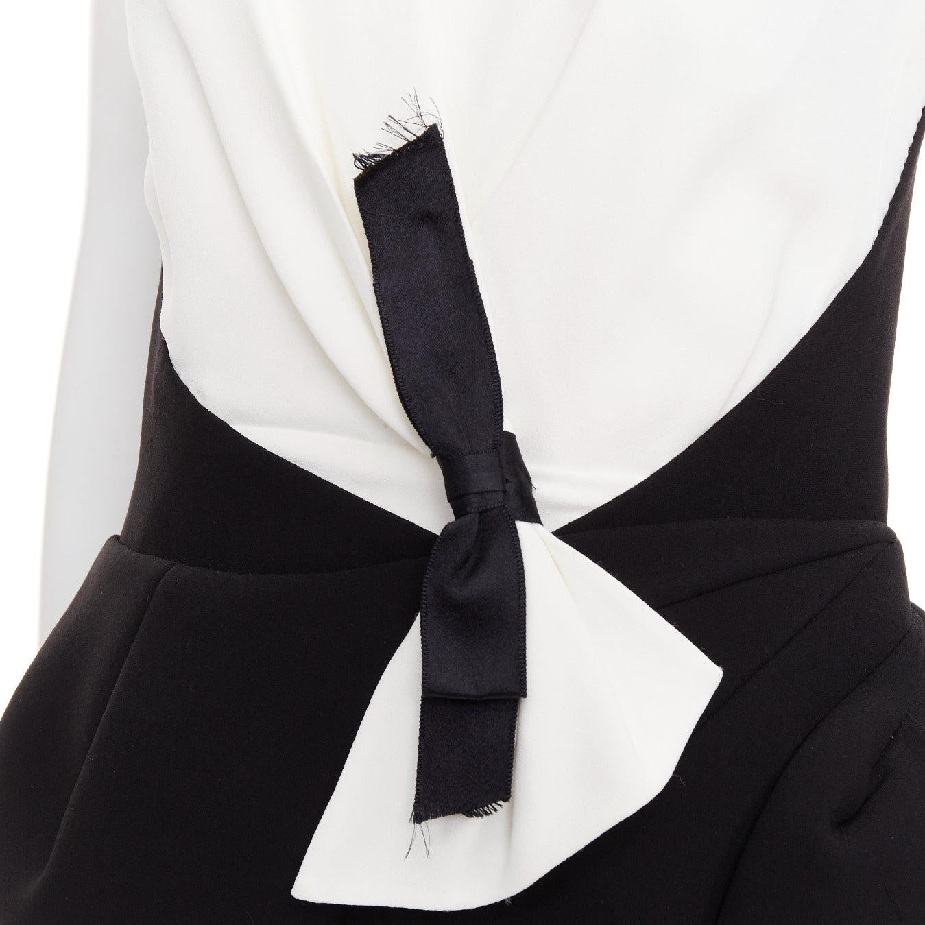 BALENCIAGA 2008 Runway black cream twist bow drape peplum hi-slit dress FR38 M
Reference: NKLL/A00527
Brand: Balenciaga
Designer: Nicolas Ghesquiere
Collection: Fall Winter 2008 - Runway
Material: Acetate, Blend
Color: Black, Cream
Pattern: