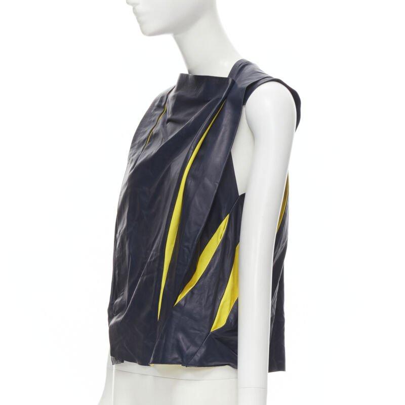 BALENCIAGA 2010 Runway Ghesquiere navy yellow leather pleated top FR38 S
Reference: MELK/A00143
Brand: Balenciaga
Designer: Nicolas Ghesquiere
Collection: Spring Summer 2010 Look 23 - Runway
Material: Leather
Color: Navy, Yellow
Pattern: