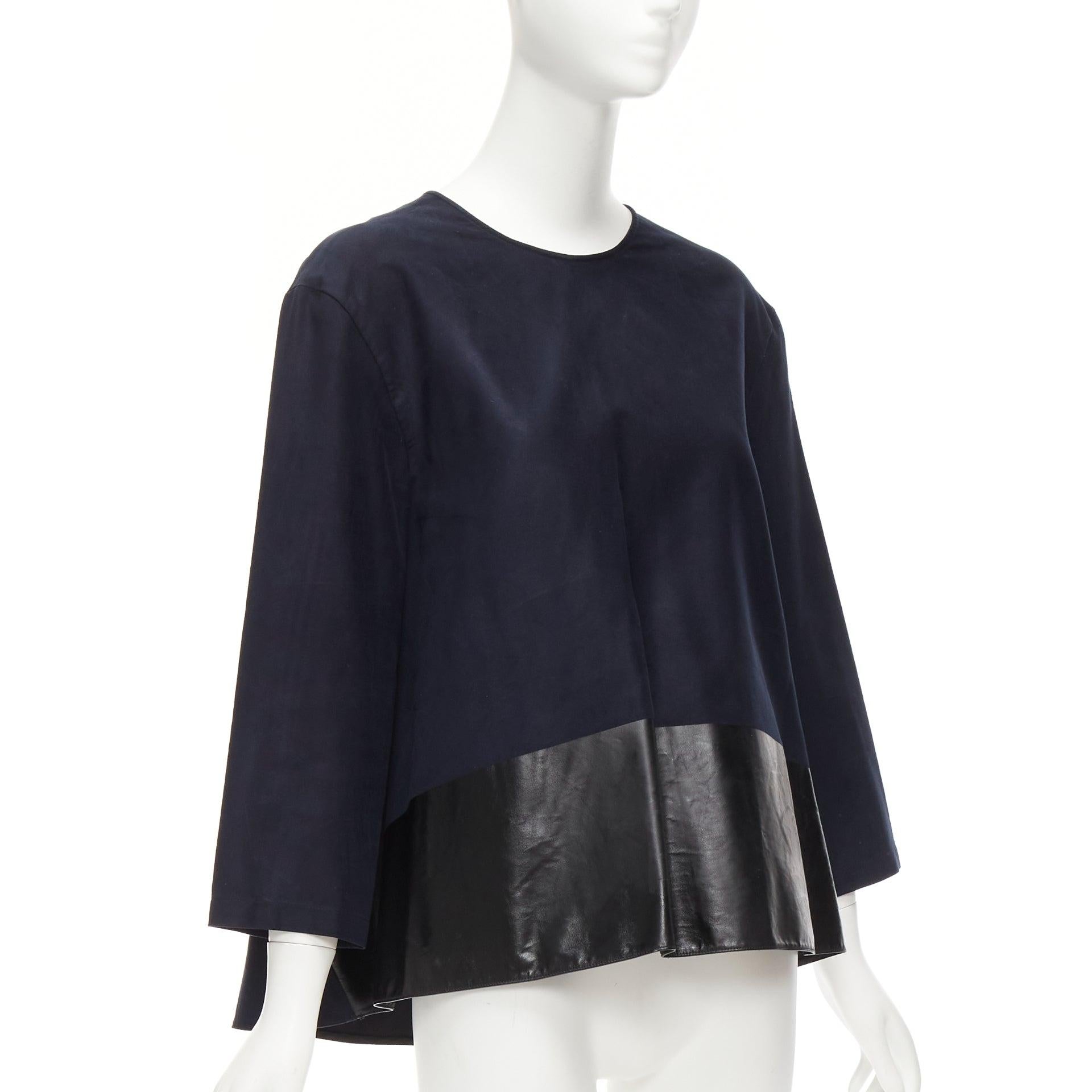 BALENCIAGA 2012 black coated hem 3/4 sleeves flared boxy top FR38 M
Reference: DYTG/A00030
Brand: Balenciaga
Designer: Nicolas Ghesquiere
Collection: 2012
Material: Polyester
Color: Black
Pattern: Solid
Closure: Zip
Extra Details: Back zip. Panelled