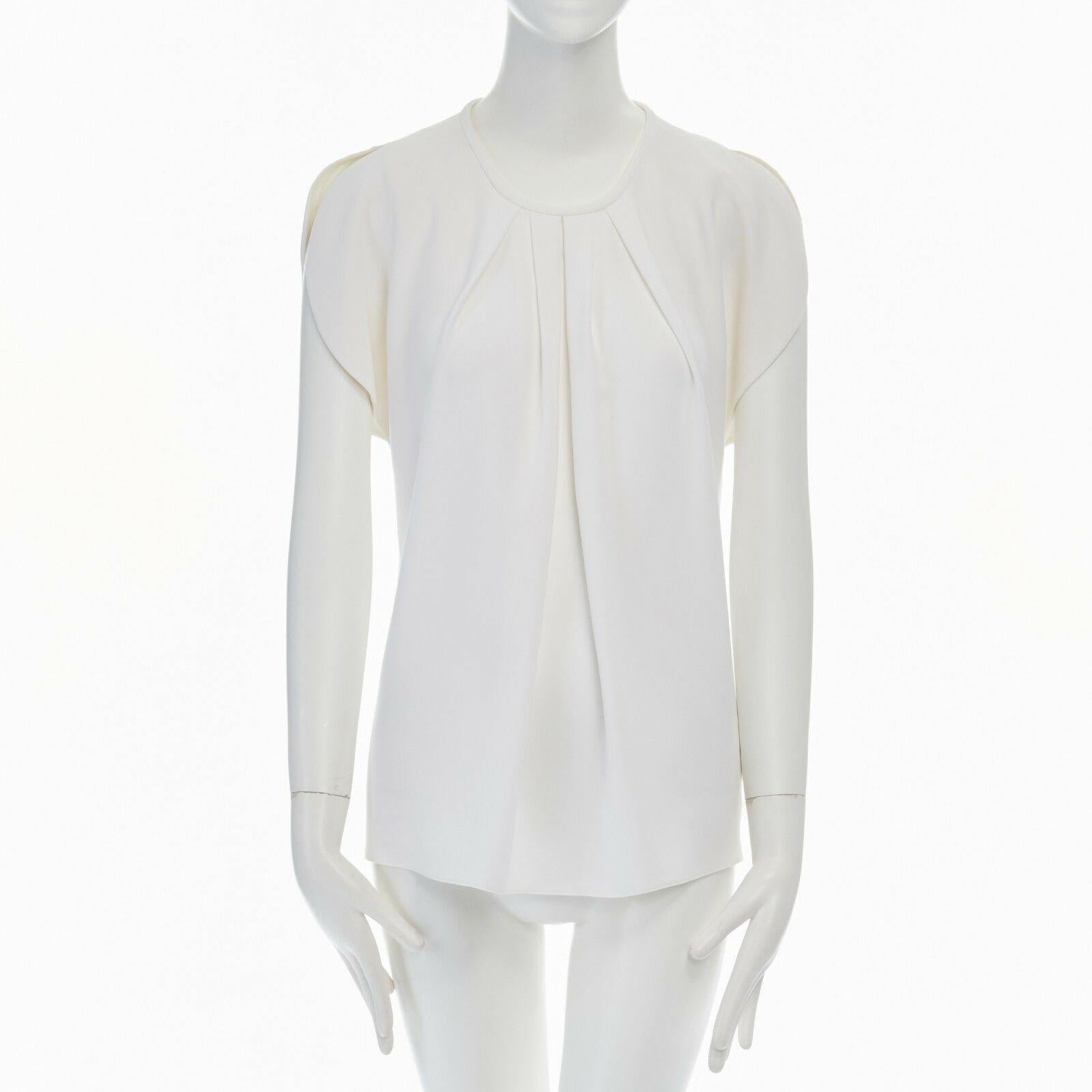 BALENCIAGA 2012 white crepe rounded sleeves blouse top FR36 S 
Reference: CC/AECG00084 
Brand: Balenciaga 
Designer: Demna Gvasalia 
Collection: 2012 
Material: Acetate 
Color: White 
Pattern: Solid 
Extra Detail: Triacetate, polyester, silk. White.