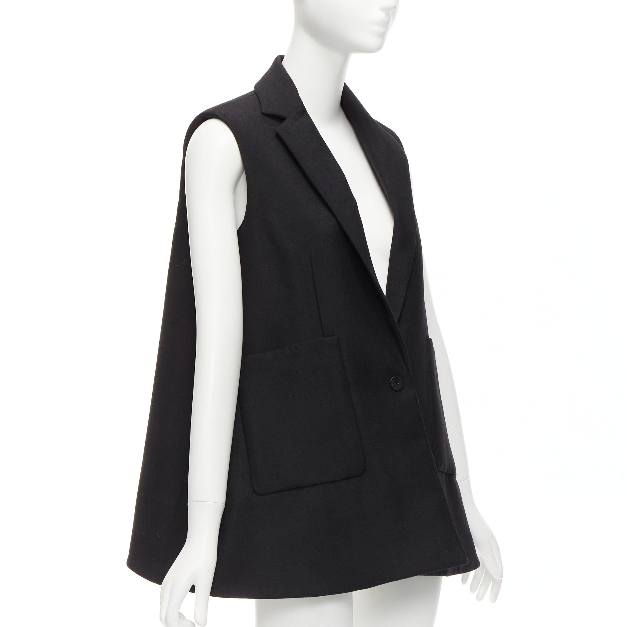 BALENCIAGA 2014 black virgin wool mohair bell shaped deep V blazer vest FR34 XS
Reference: NKLL/A00184
Brand: Balenciaga
Designer: Nicolas Ghesquiere
Collection: 2014
Material: Virgin Wool, Mohair
Color: Black
Pattern: Solid
Closure: Button
Lining: