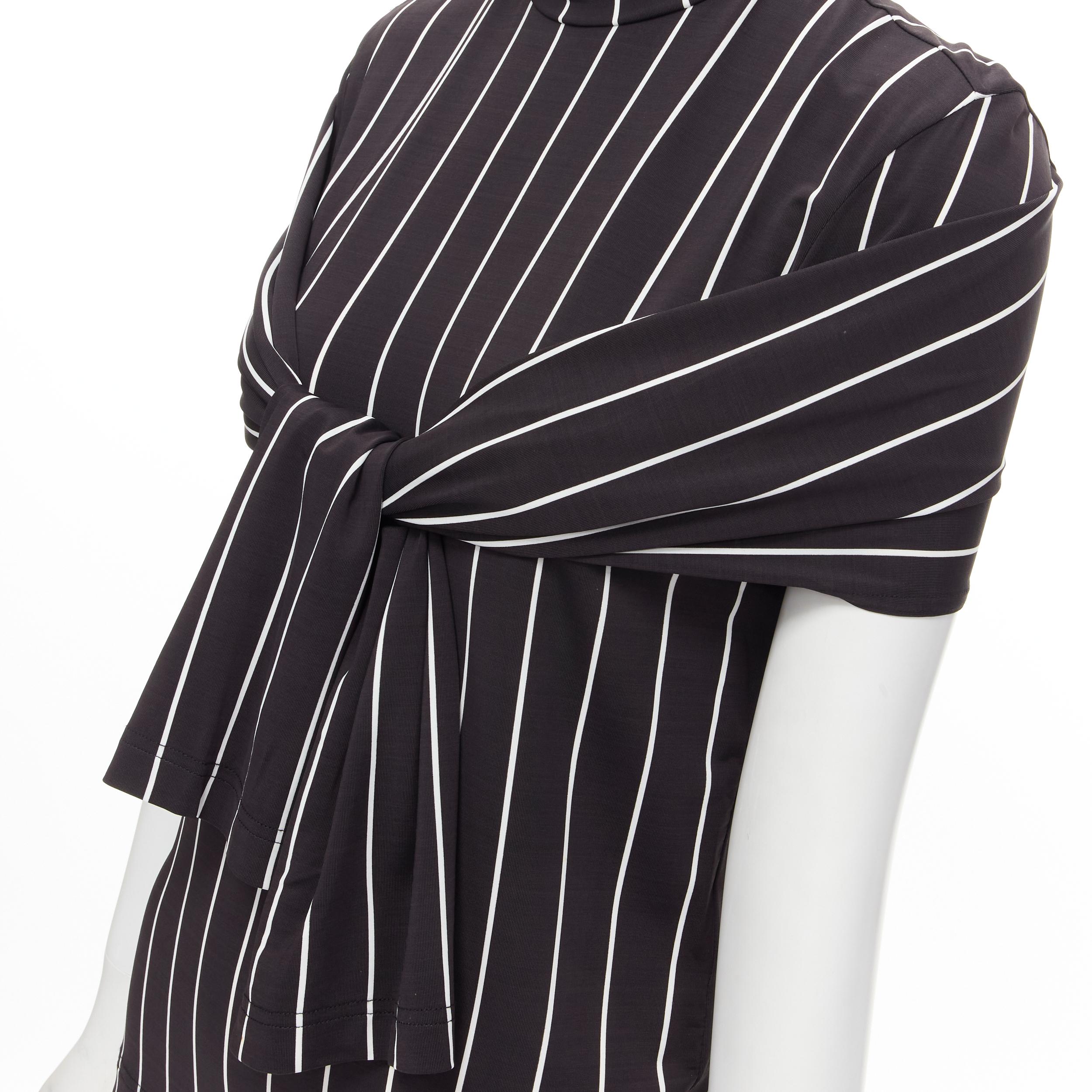BALENCIAGA 2016 black white vertical stripe underarm slit cut out turtleneck top XS 
Reference: MELK/A00151 
Brand: Balenciaga 
Designer: Demna 
Collection: 2016 
Material: Viscose 
Color: Black 
Pattern: Striped 
Extra Detail: Cut out slit at