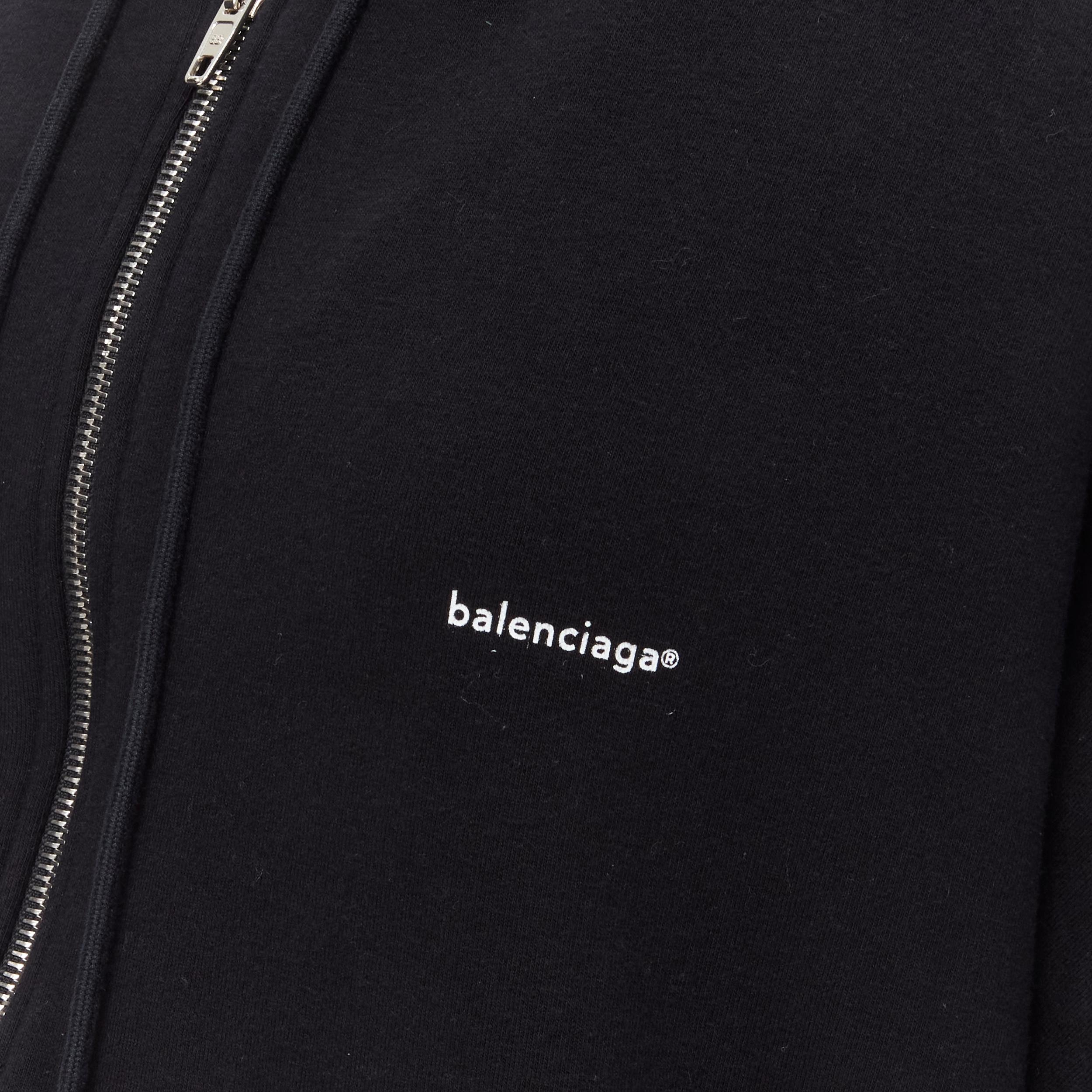 BALENCIAGA 2018 Demna black cotton white logo print oversized zip up hoodie M 
Reference: MELK/A00027
Brand: Balenciaga 
Designer: Demna 
Collection: 2018 
Material: Cotton 
Color: Black 
Pattern: Solid 
Closure: Zip 
Extra Detail: BB logo on