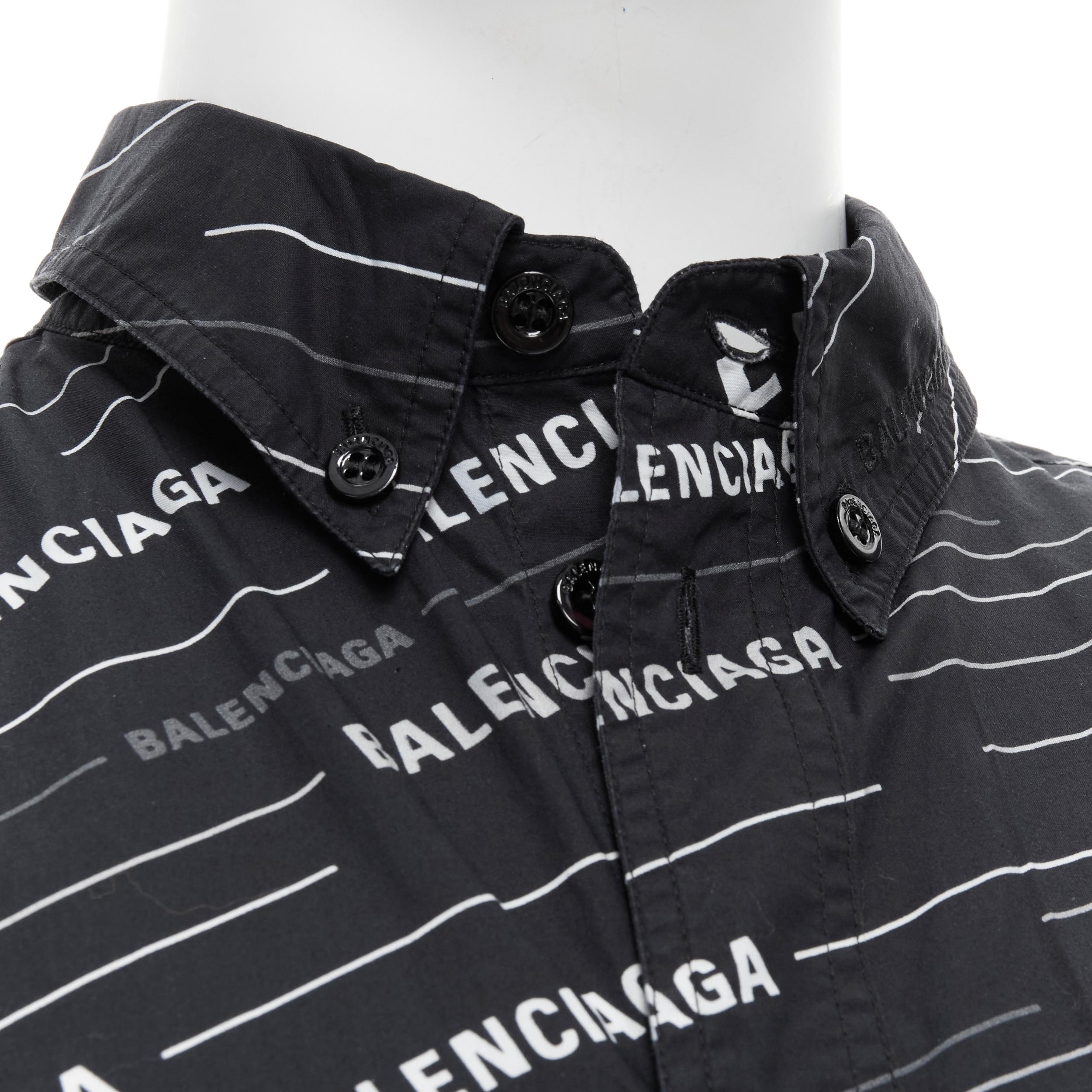 BALENCIAGA 2018 Demna black white logo print oversized shirt EU38 S 
Reference: TGAS/B01885 
Brand: Balenciaga 
Designer: Demna Gvasalia 
Collection: 2018 
Material: Cotton 
Color: Black 
Closure: Button 
Extra Detail: Flap breast pocket. 
Made in: