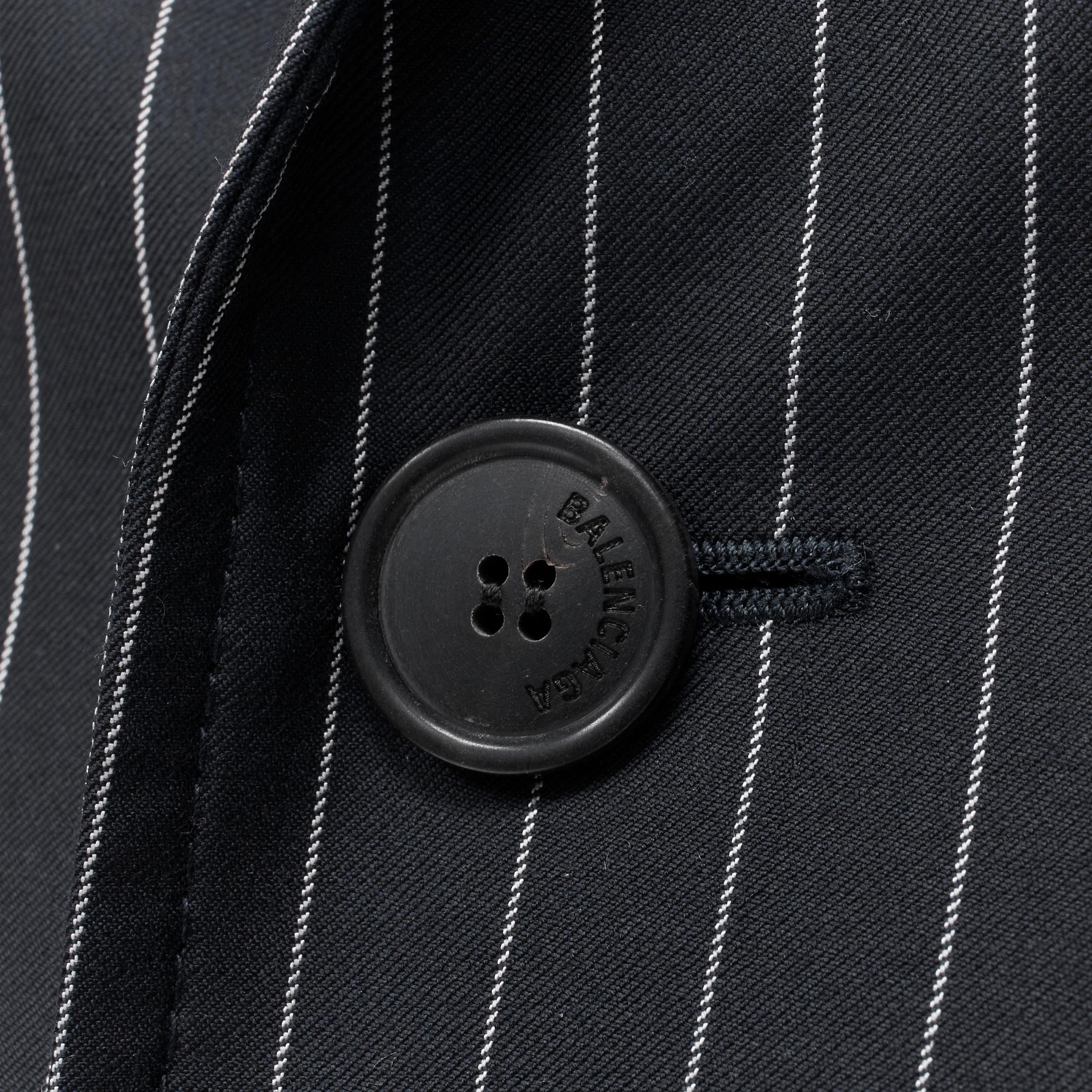 BALENCIAGA 2018 Hourglass navy pinstripe padded shoulder peplum blazer FR34 
Reference: TGAS/B01870 
Brand: Balenciaga 
Designer: Demna Gvasalia 
Material: Wool 
Color: Navy 
Pattern: Pinstripe 
Closure: Button 
Extra Detail: Fitted at waist. 
Made