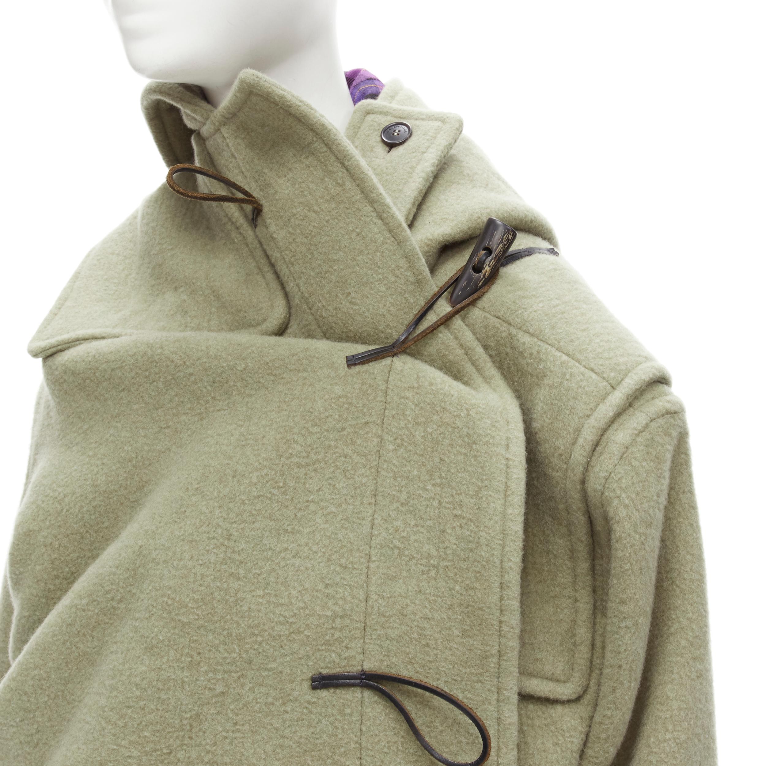 BALENCIAGA 2018 Runway Pulled khaki grey toggle wrap coat M
Brand: Balenciaga
Designer: Demna
Collection: 2018 Puled 
Material: Feels like wool
Color: Green
Pattern: Solid
Closure: Toggle
Extra Detail: Wooden horn toggle buttons. Signle toggle