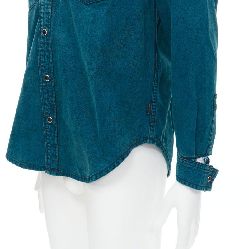 BALENCIAGA 2018 turquoise acid dye washed heavy cotton ripped cuff shirt EU38 S
Reference: CNTG/A00021
Brand: Balenciaga
Designer: Demna
Collection: 2018
Material: Denim
Color: Blue
Pattern: Solid
Closure: Button
Extra Details: Black enamel snap