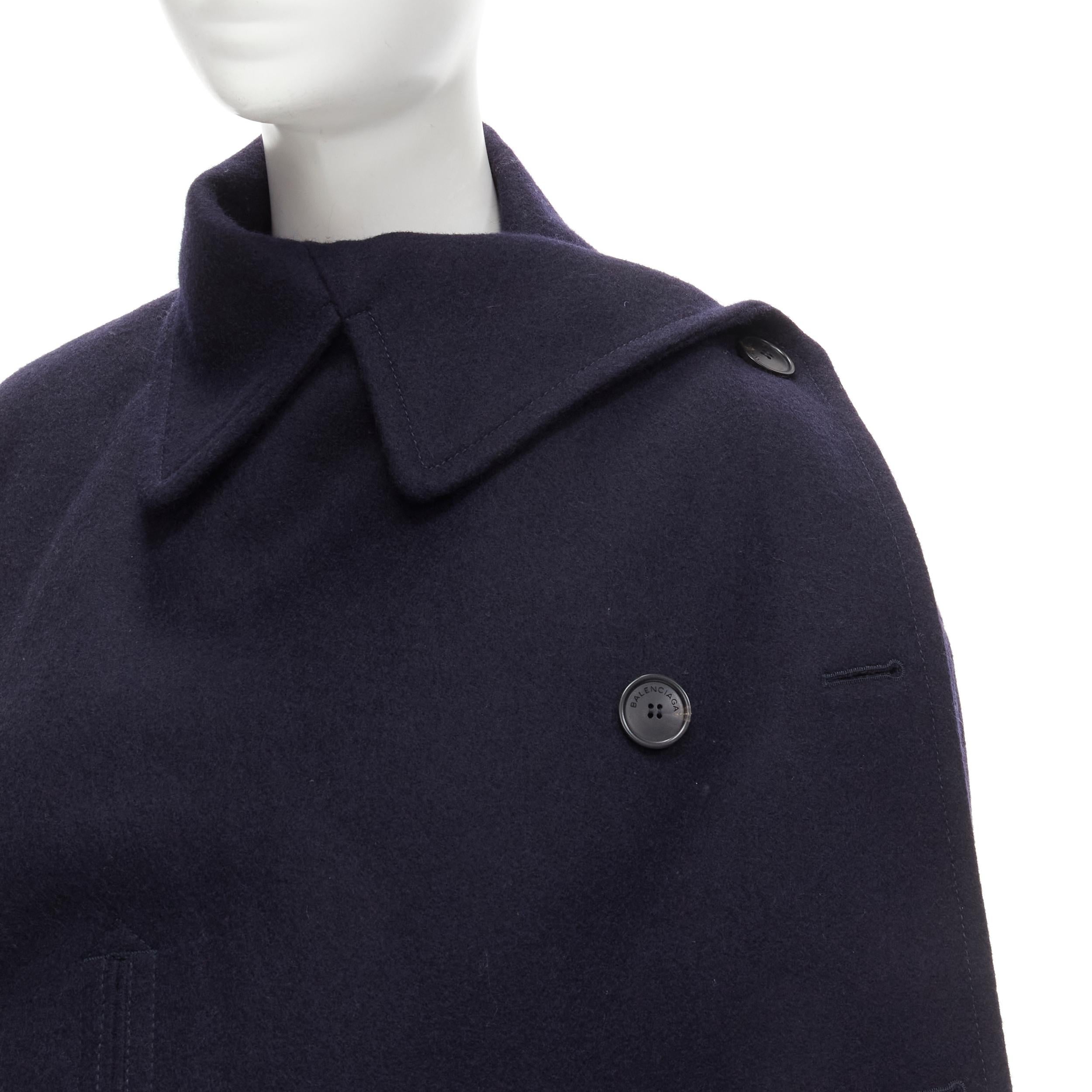 BALENCIAGA 2018 Wrap navy wool deconstructed double breasted coat M
Brand: Balenciaga
Designer: Demna
Collection: 2018 Wrap 
Material: Wool
Color: Navy
Pattern: Solid
Closure: Button
Extra Detail: Asymmetric cut with single button at shoulder