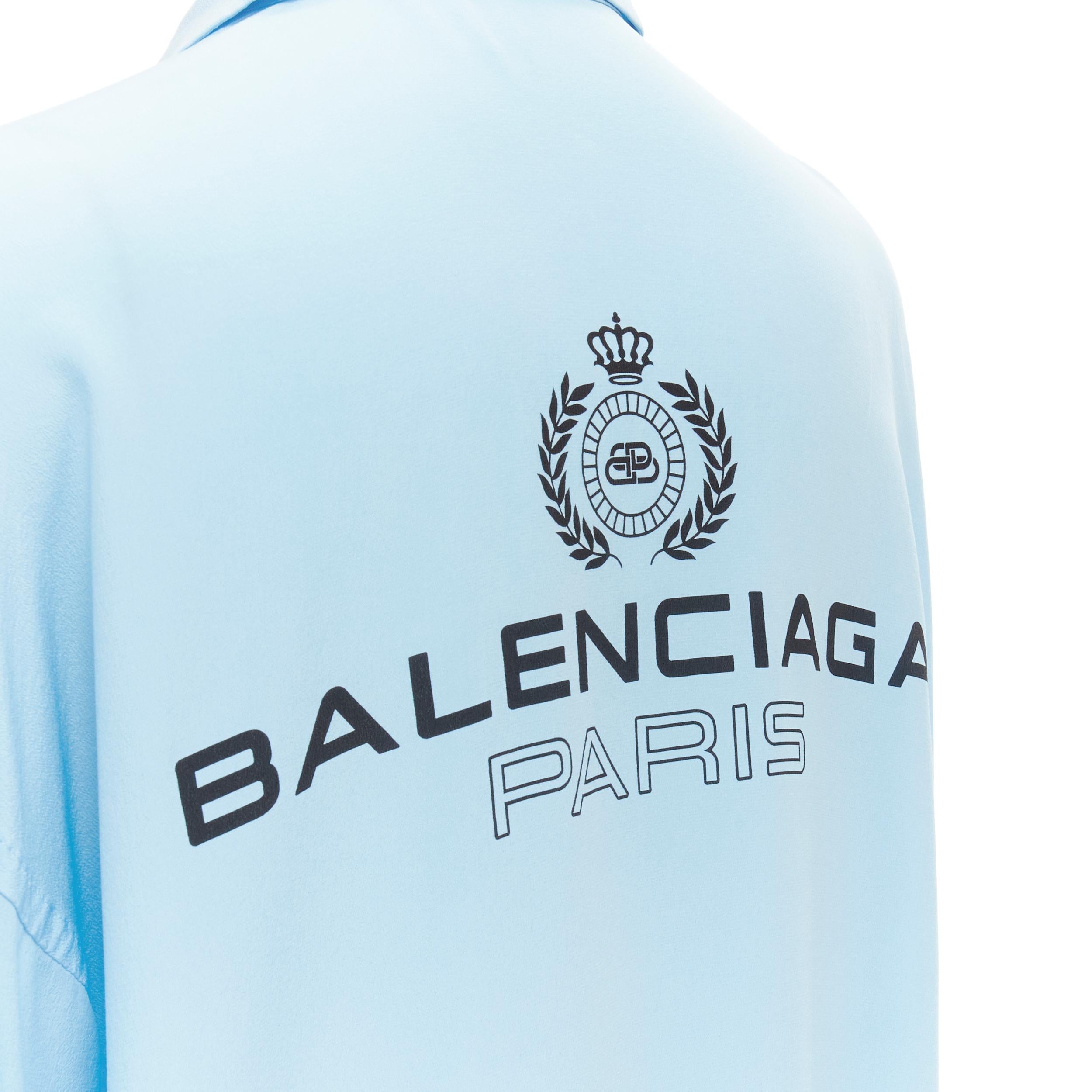 BALENCIAGA 2019 Demna 100% silk light blue logo print back shirt FR34 XS 
Reference: KEDG/A00078 
Brand: Balenciaga 
Designer: Demna 
Collection: 2019 
Material: Silk 
Color: Blue 
Pattern: Solid 
Closure: Button 
Made in: Hungary 

CONDITION: