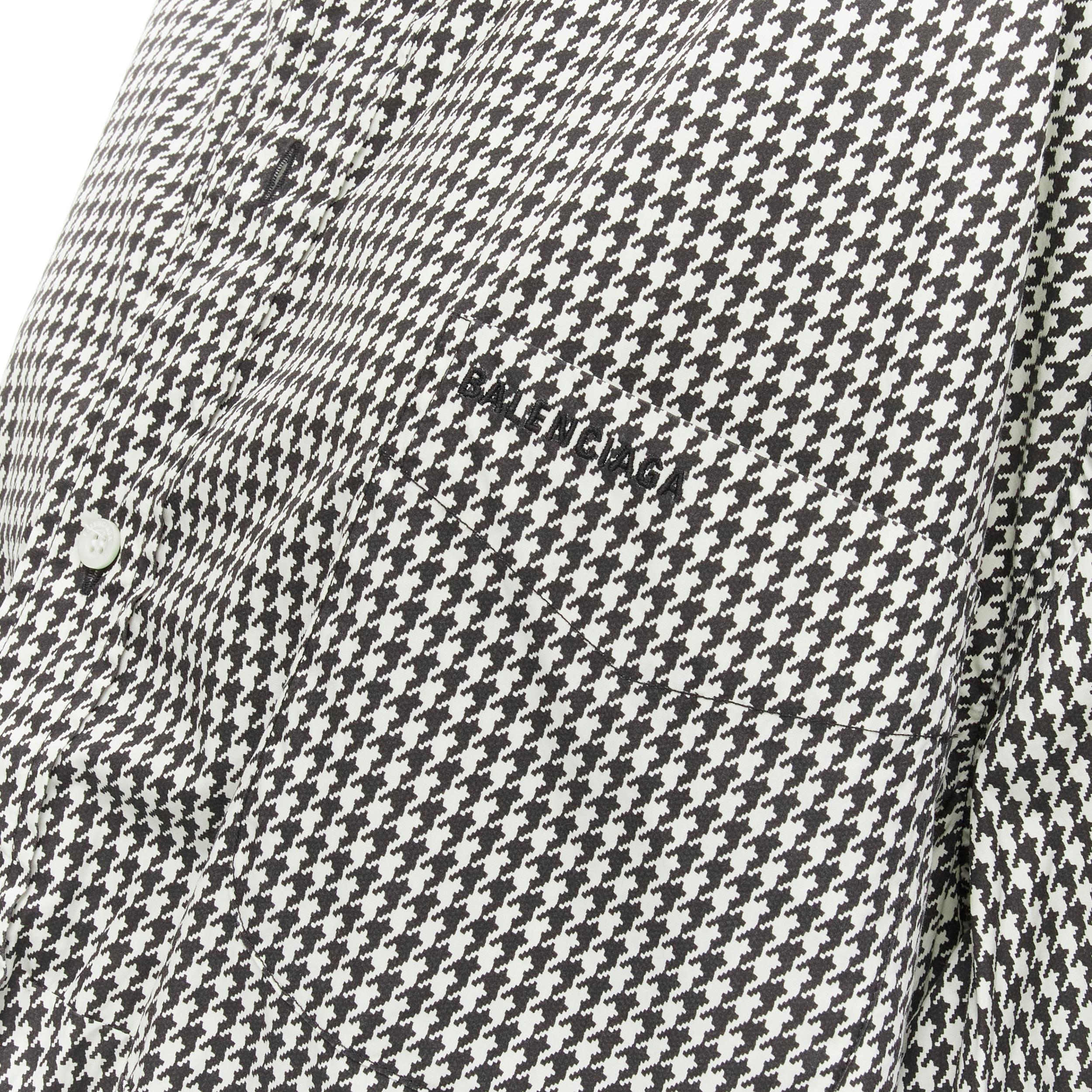 BALENCIAGA 2020 houndstooth logo embroidered pocket Swing shirt FR36 XS 
Reference: KEDG/A00085 
Brand: Balenciaga 
Designer: Demna 
Collection: 2020 
Material: Cotton 
Color: Black 
Pattern: Houndstooth 
Closure: Button 
Extra Detail: Logo