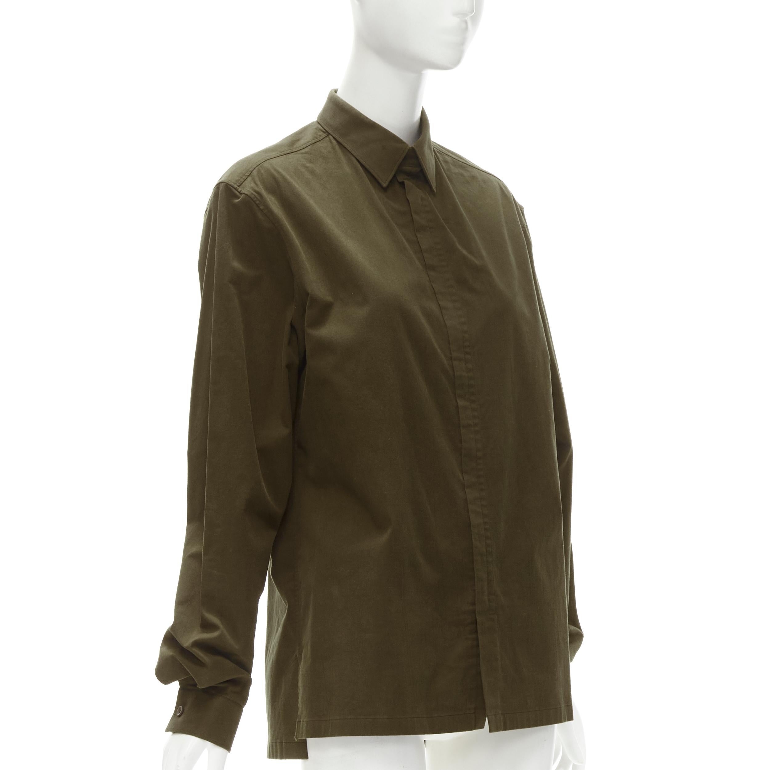 BALENCIAGA army green cotton-blend concealed zip front shirt EU38 S
Brand: Balenciaga
Material: Cotton
Color: Green
Pattern: Solid
Closure: Zip
Extra Detail: Army green/brown cotton-blend. Shirt collar with tab button. Concealed front zip. Center
