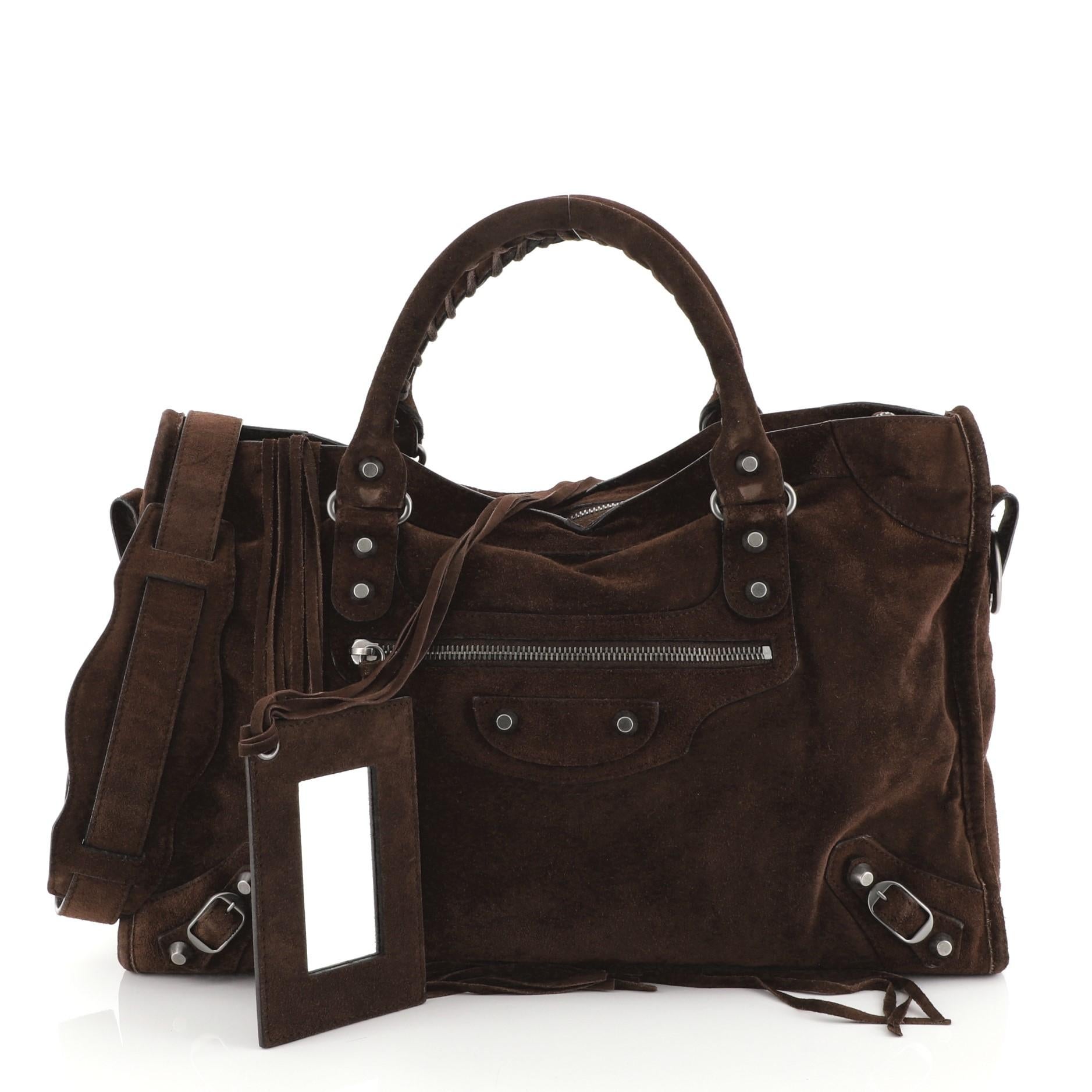 This Balenciaga Baby Daim City Classic Studs Bag Suede Medium, crafted in brown suede, features front zip pocket, braided hand-stitched handles, classic studs details and matte gunmetal-tone hardware. Its zip closure opens to a black fabric interior
